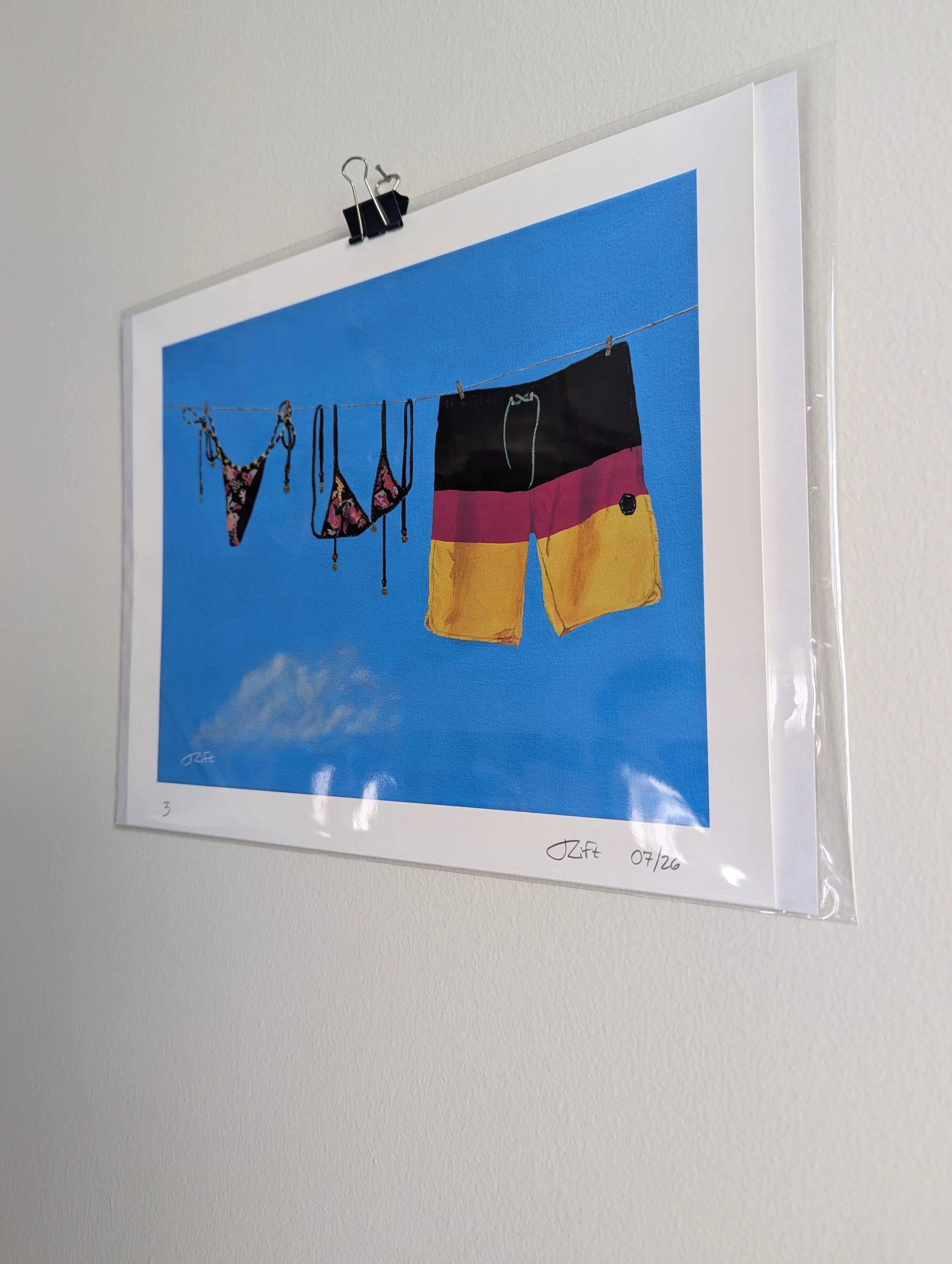 couples swimsuits hanging on a line print2