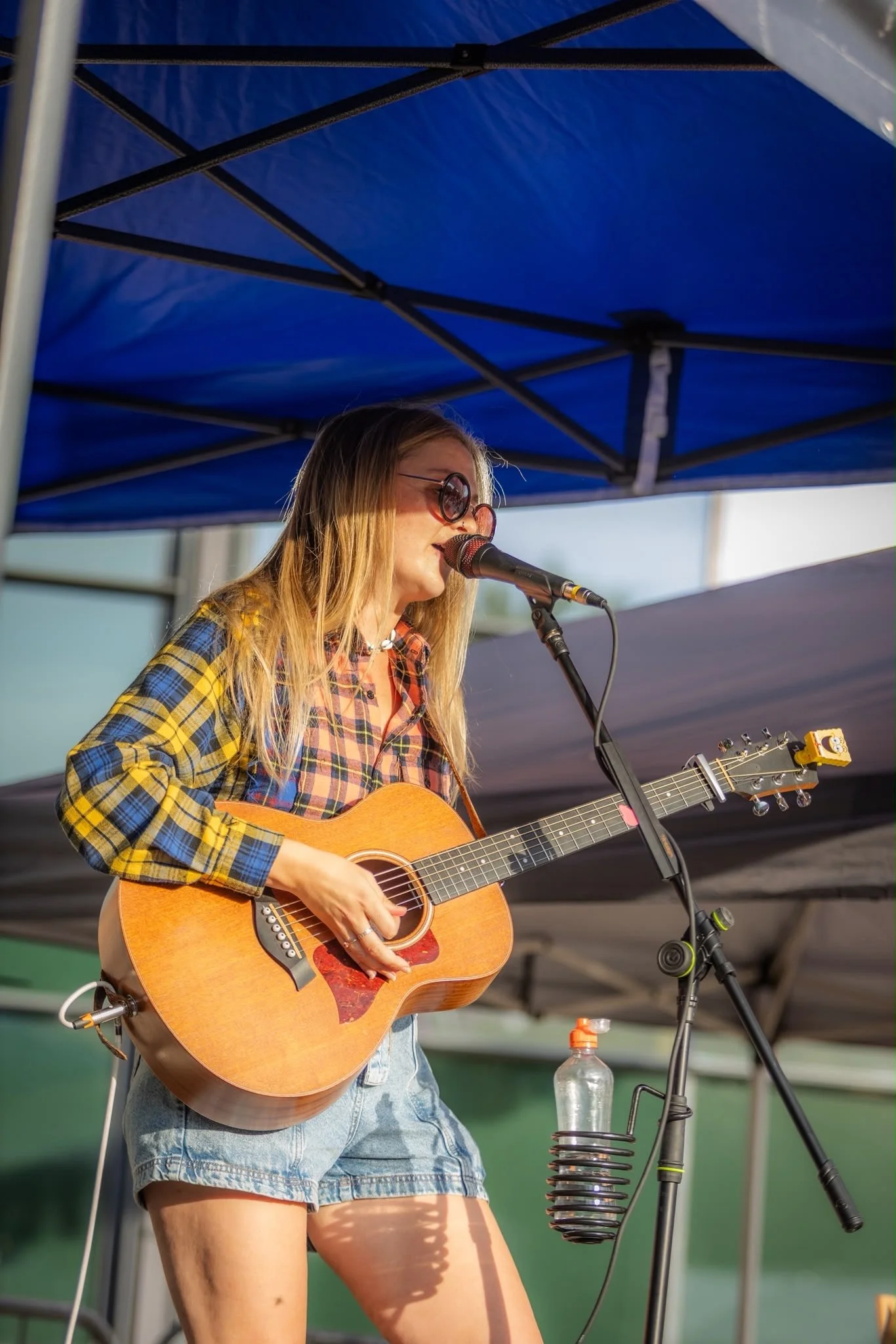 Louise Parker singing live with an acoustic guitar at Bay Days Festival in Chelmsford, Essex.