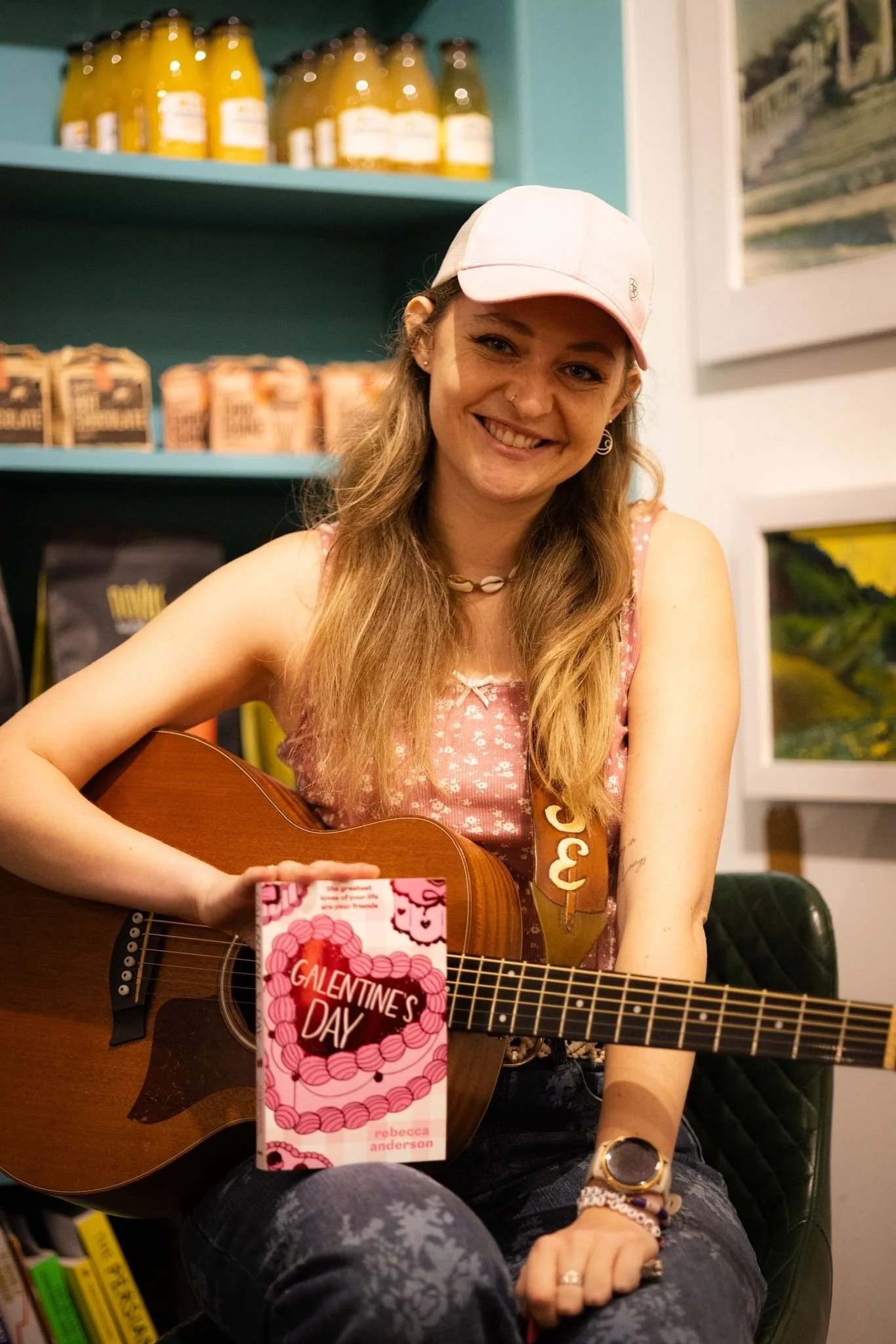 Louise Parker, UK country pop singer-songwriter, performing live in Essex with acoustic guitar at an intimate country pop gig.