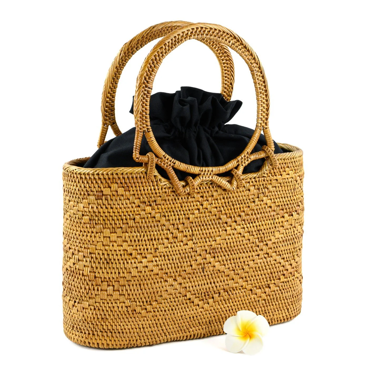 Handmade straw purse with unique honeycomb weaves, sturdy round handles, and a fabric-lined interior with drawstring closure.