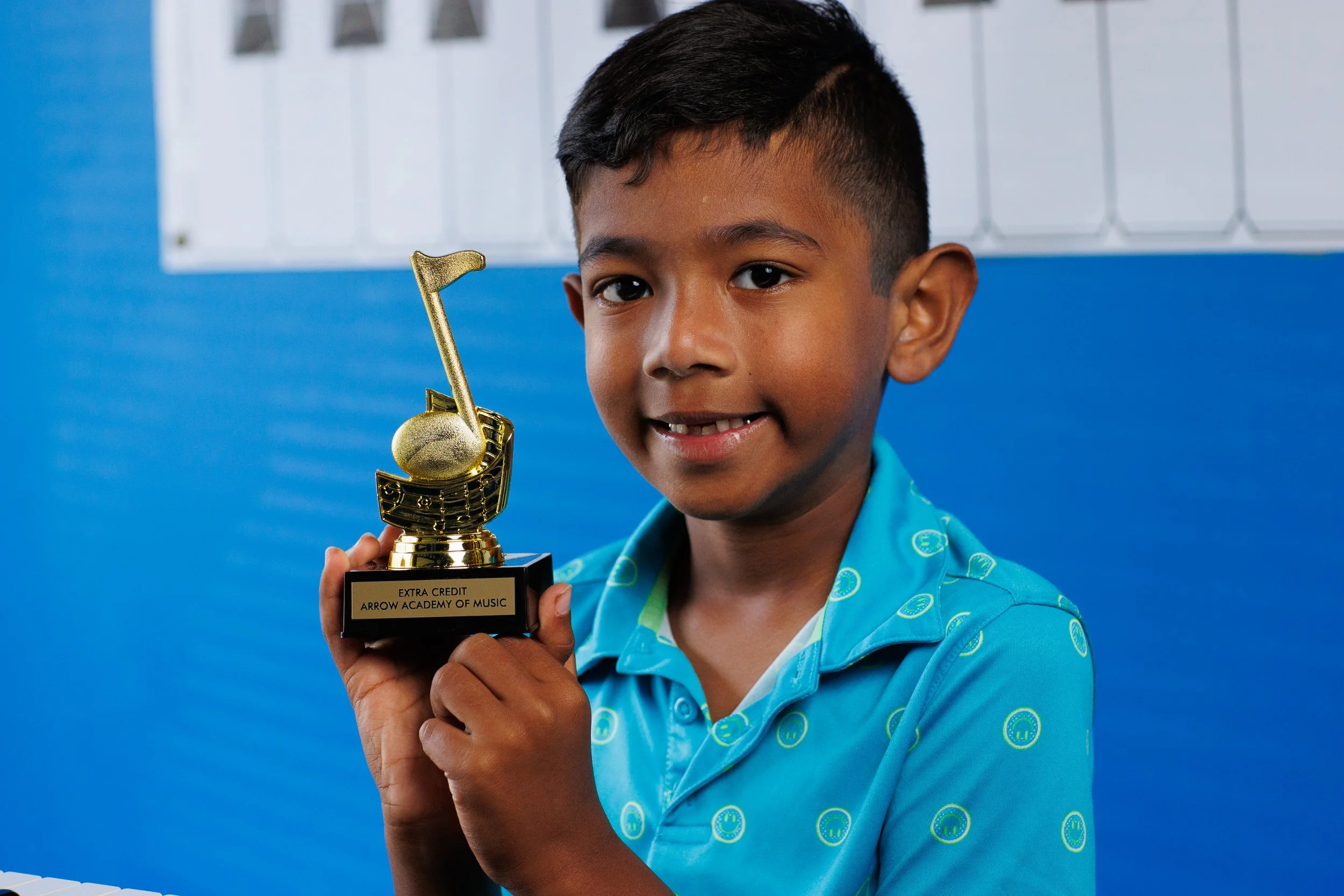 piano student with extra credit award