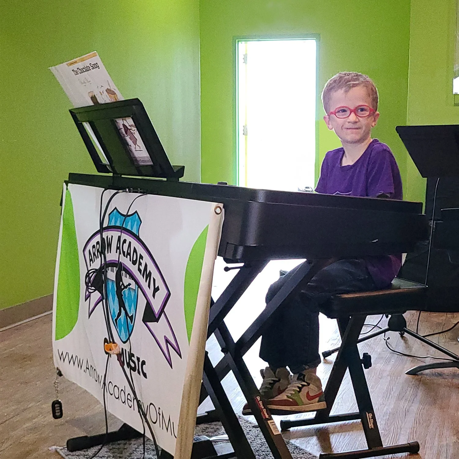 young student performing at piano during spring concert