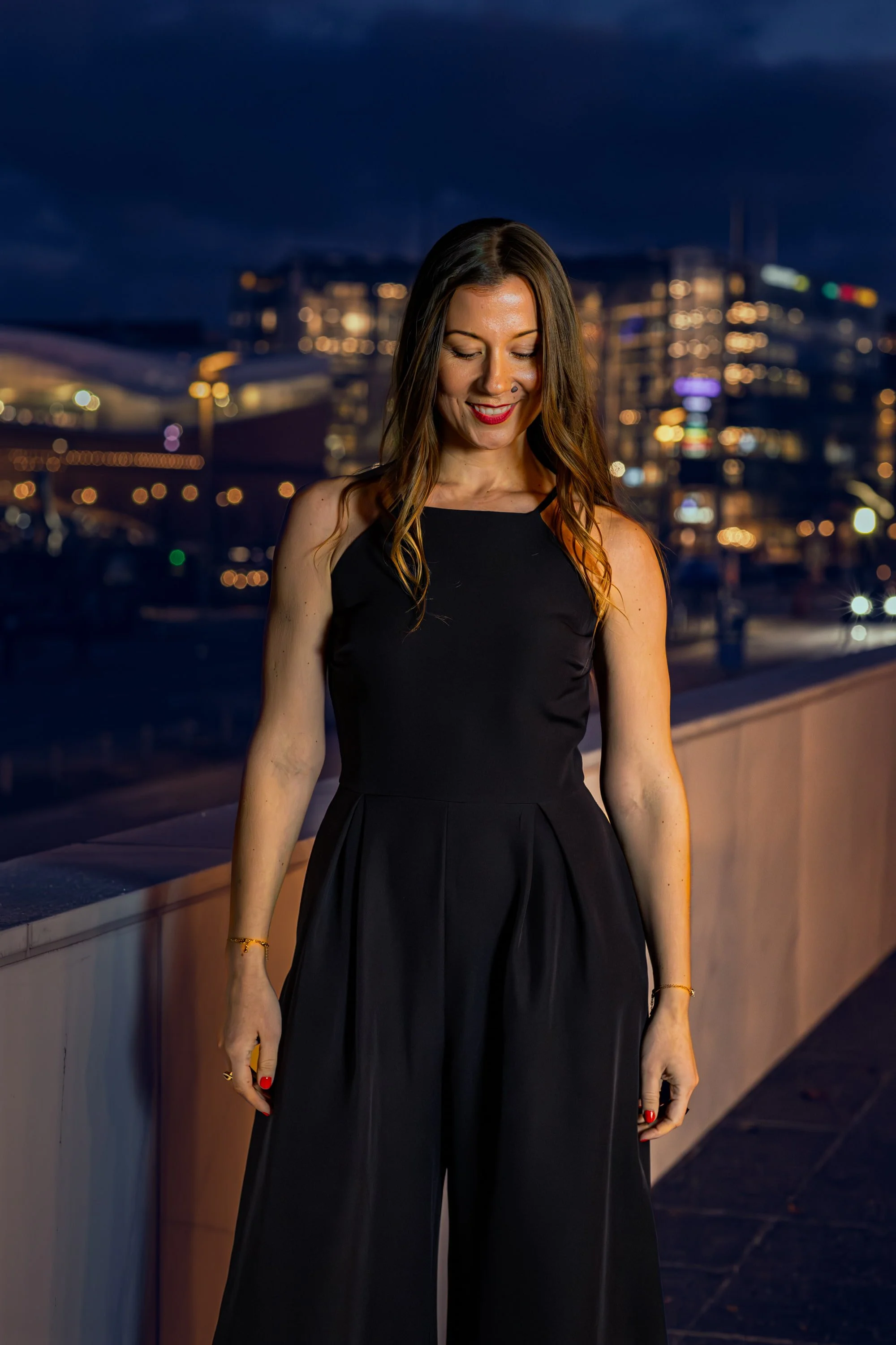 Professional host looking down and smiling