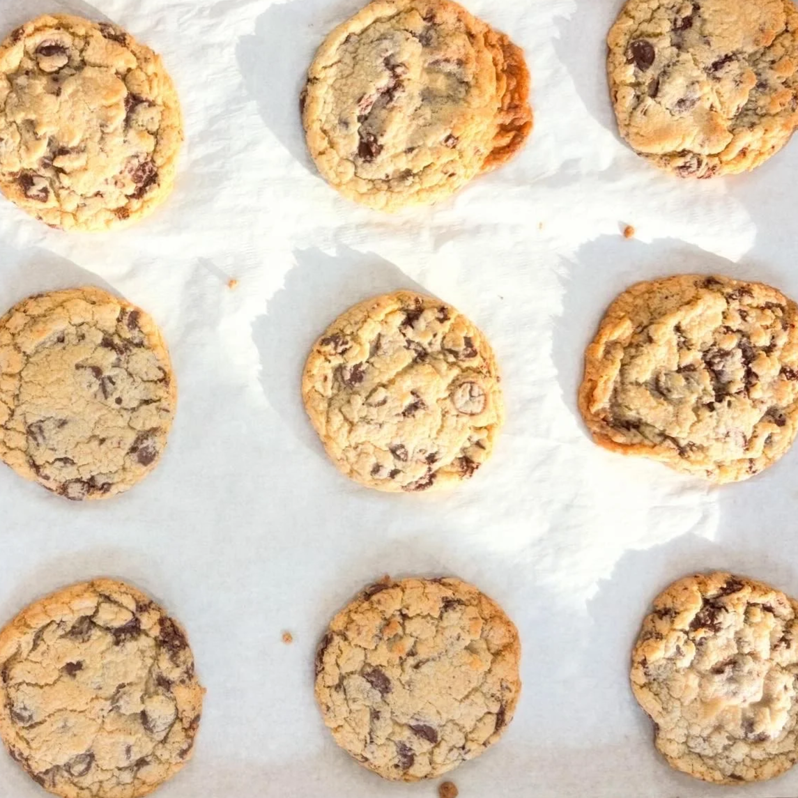 Tray of chocolate chip cookies on parchment paper