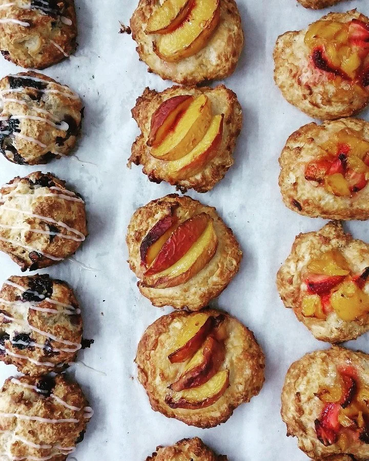 Close-up of a variety of scones with toppings 