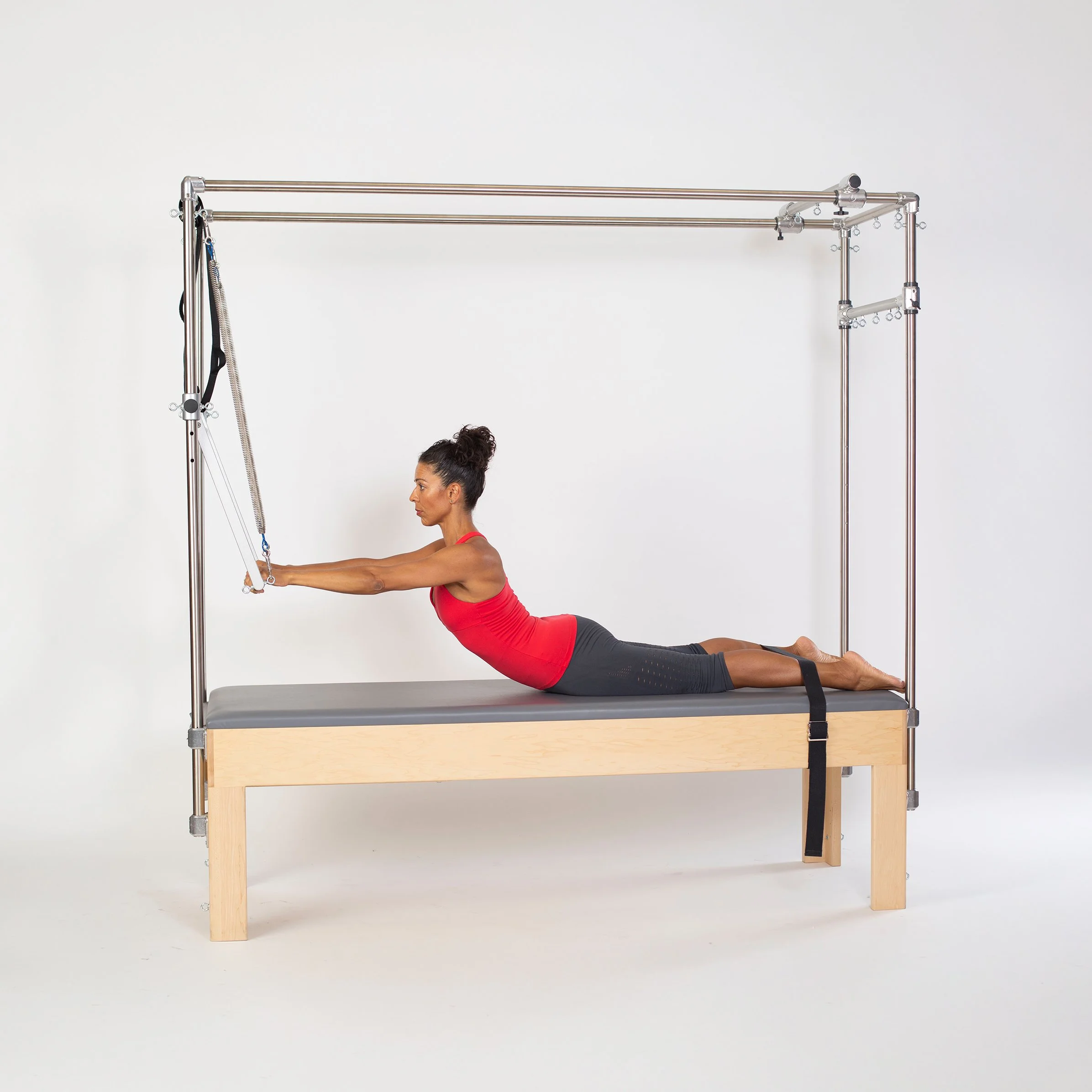 LaBriece in cadillac chair doing pilates