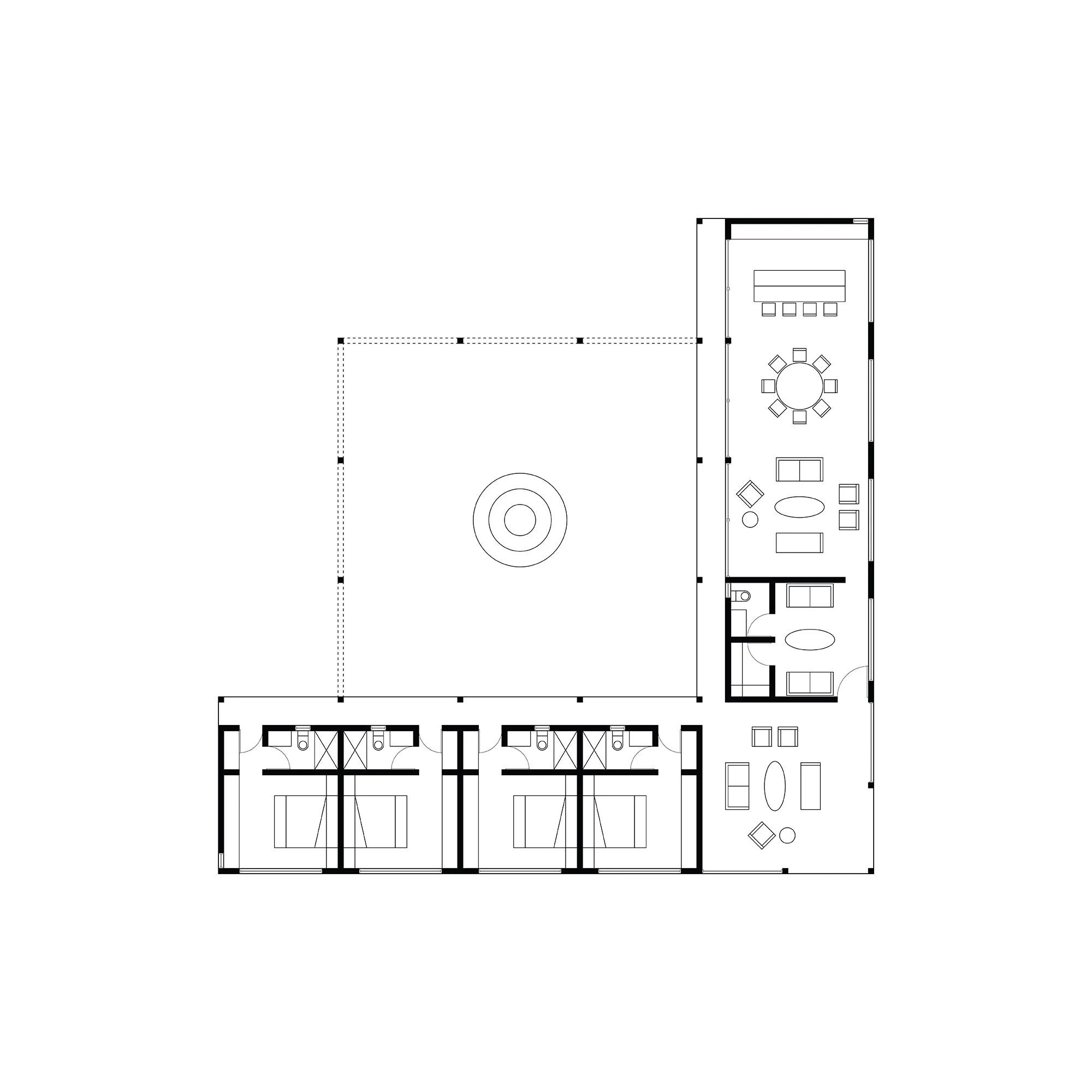 Floor plan of a building that includes multiple rooms, a central courtyard, and various furniture layouts.