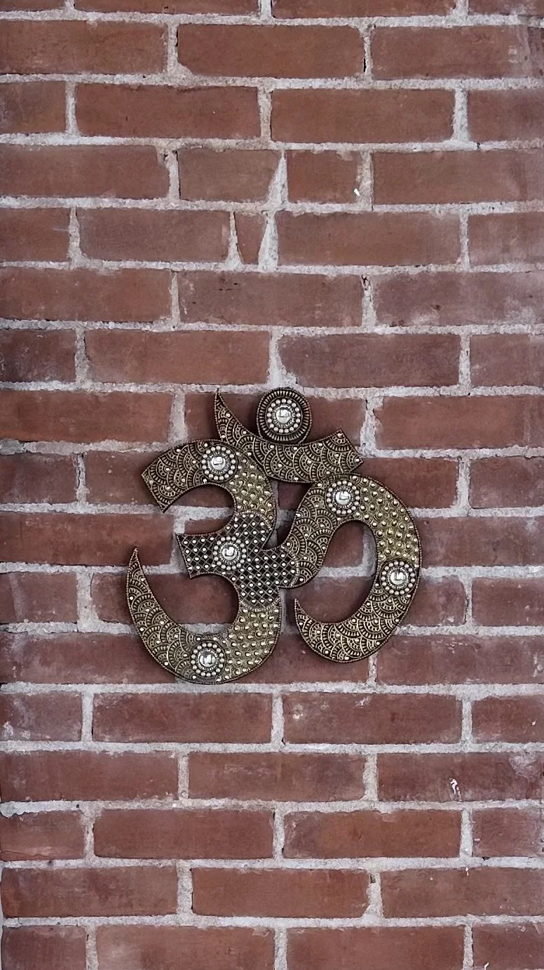 A decorative symbol on a brick wall