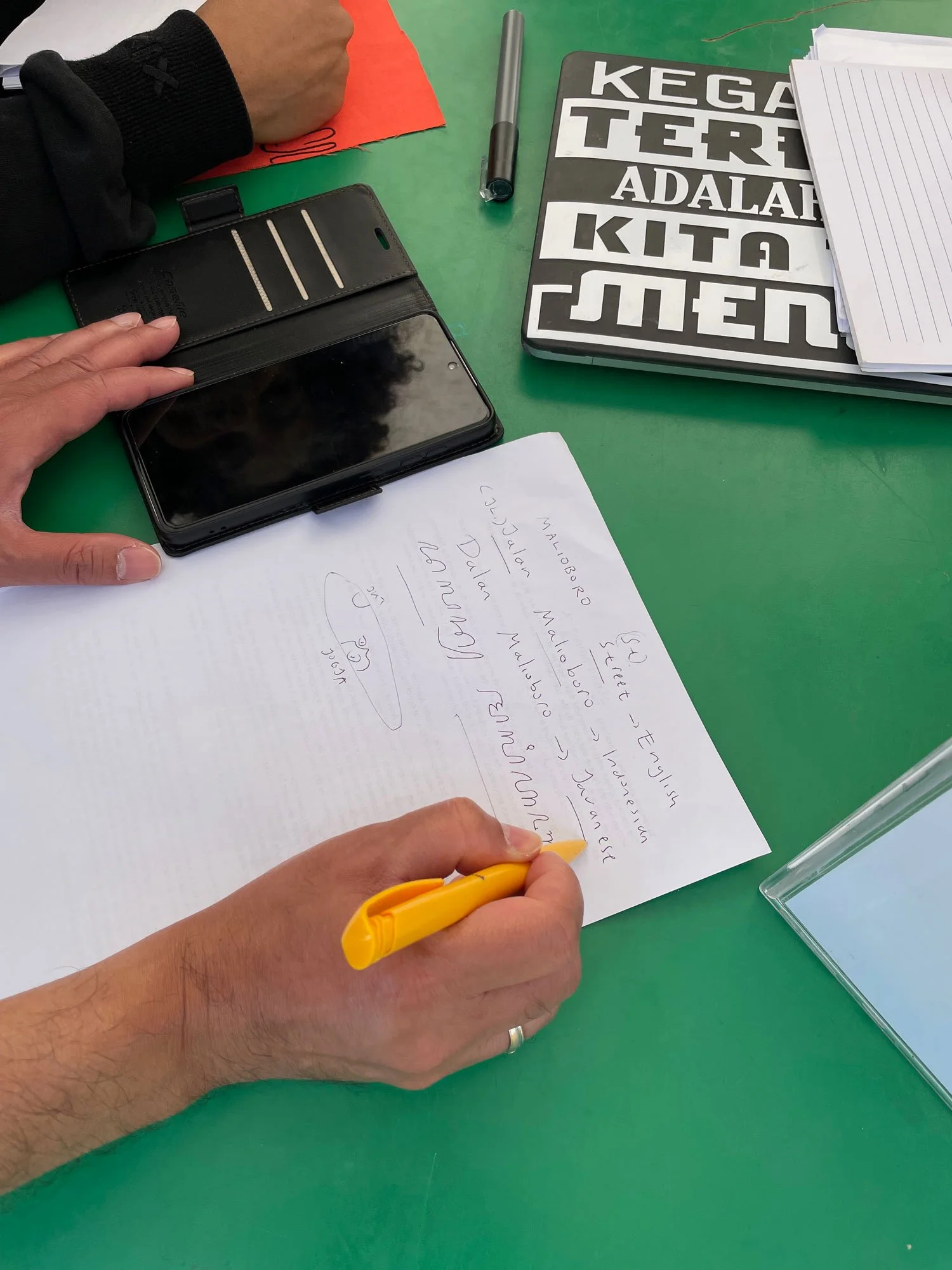 An artist demonstrating the Javanese script.