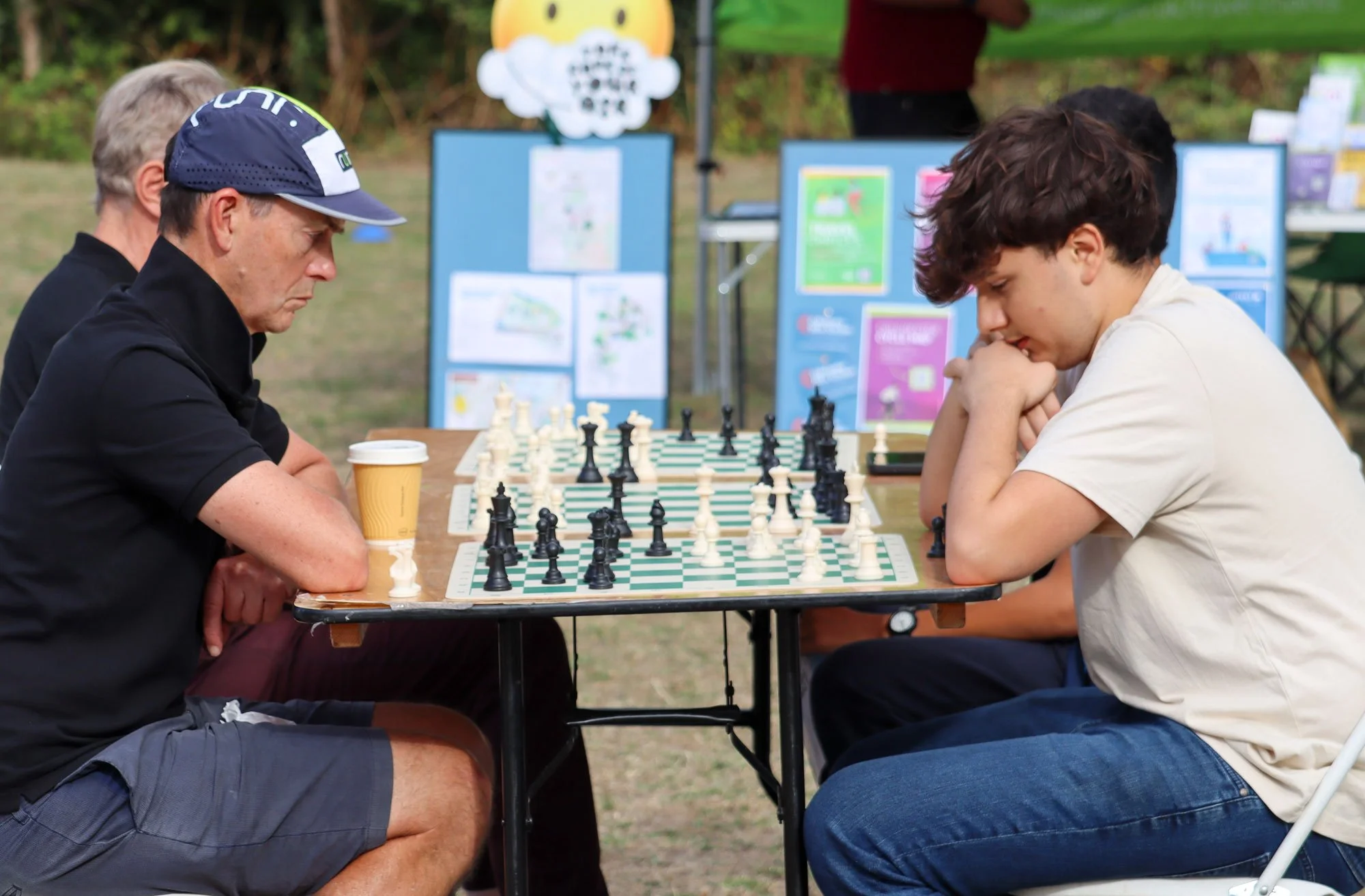 Visitors deep into a game of chess.