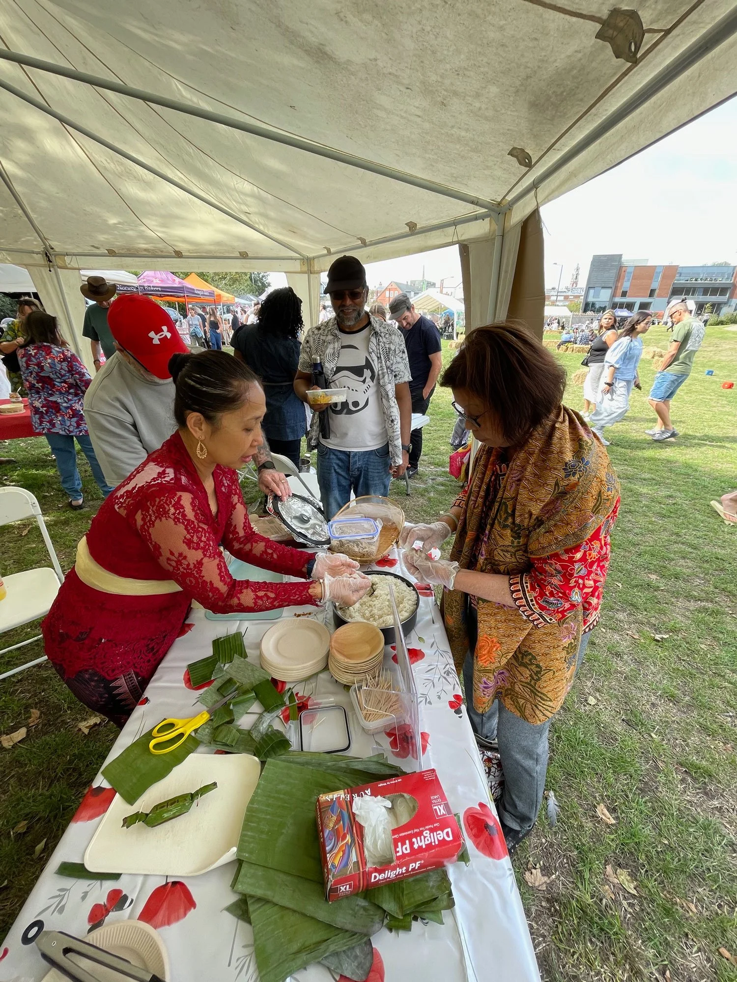 People trying out a cookery workshop.