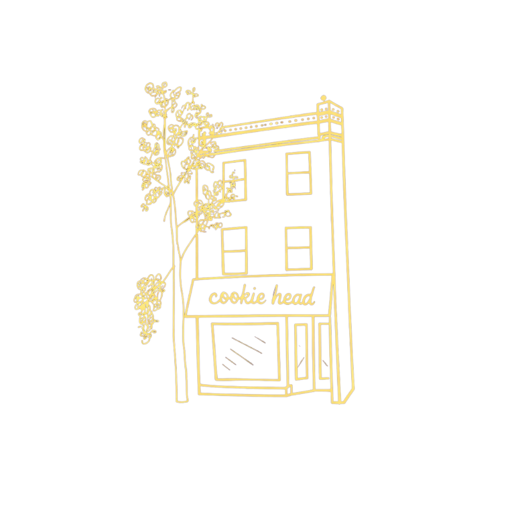 Neon illustration of a building with a sign that reads 'cookie head' and a tree on the left side.