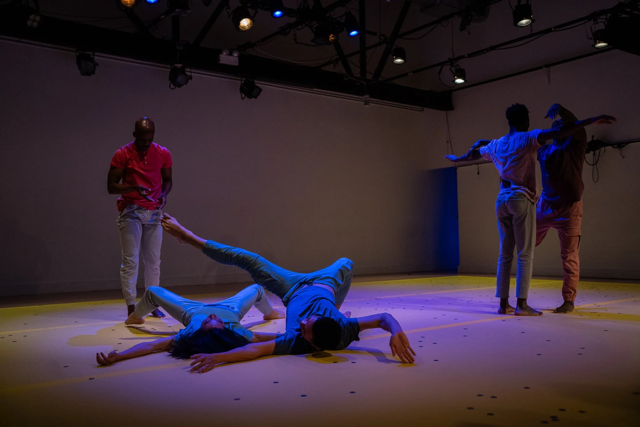 Four dancers in contrasting floor and standing positions in The Righteous Beauty of the Things Never Accounted For