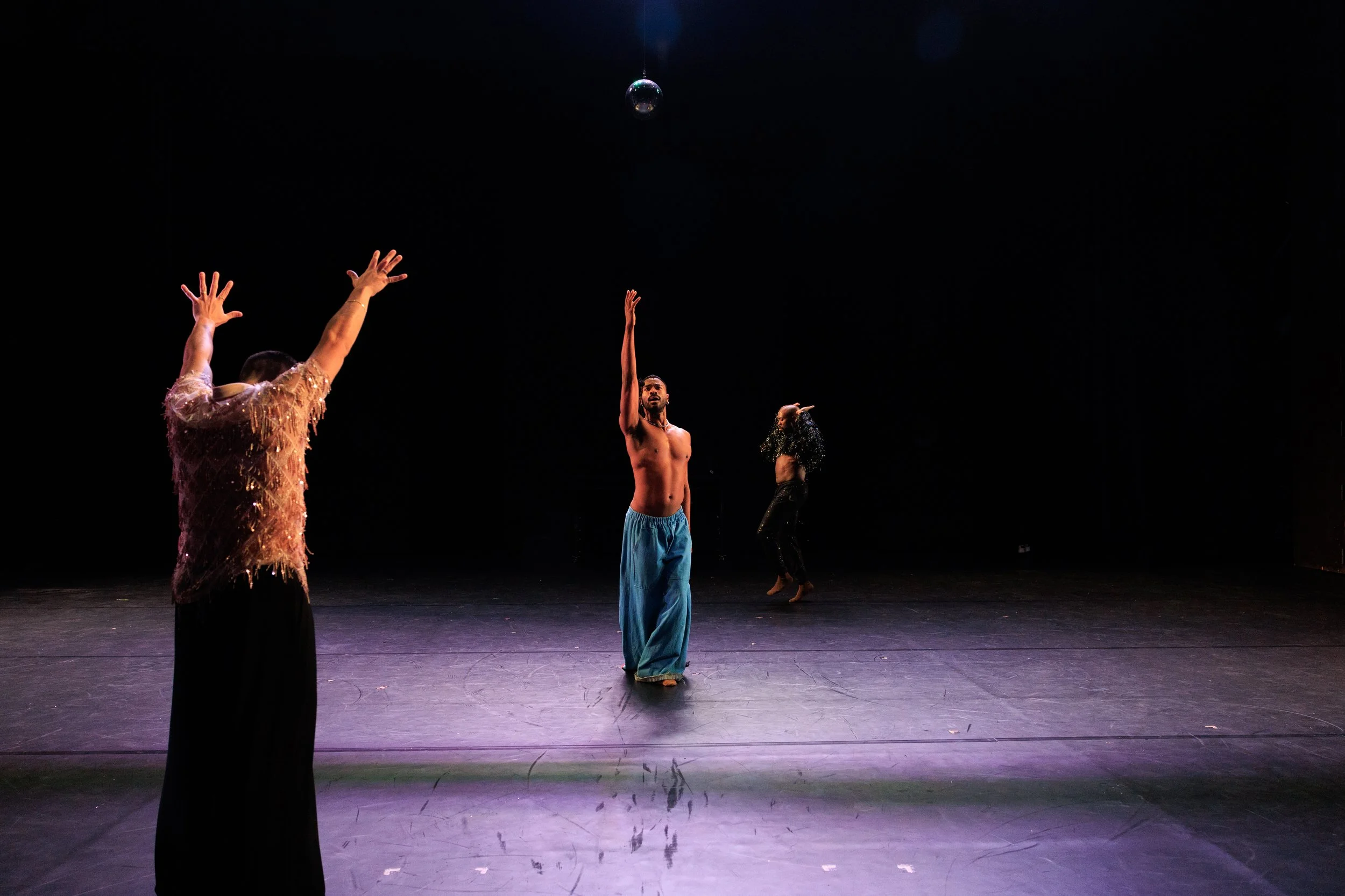 Three dancers performing beneath a disco ball in Sissies: Something Perfect Between Ourselves.