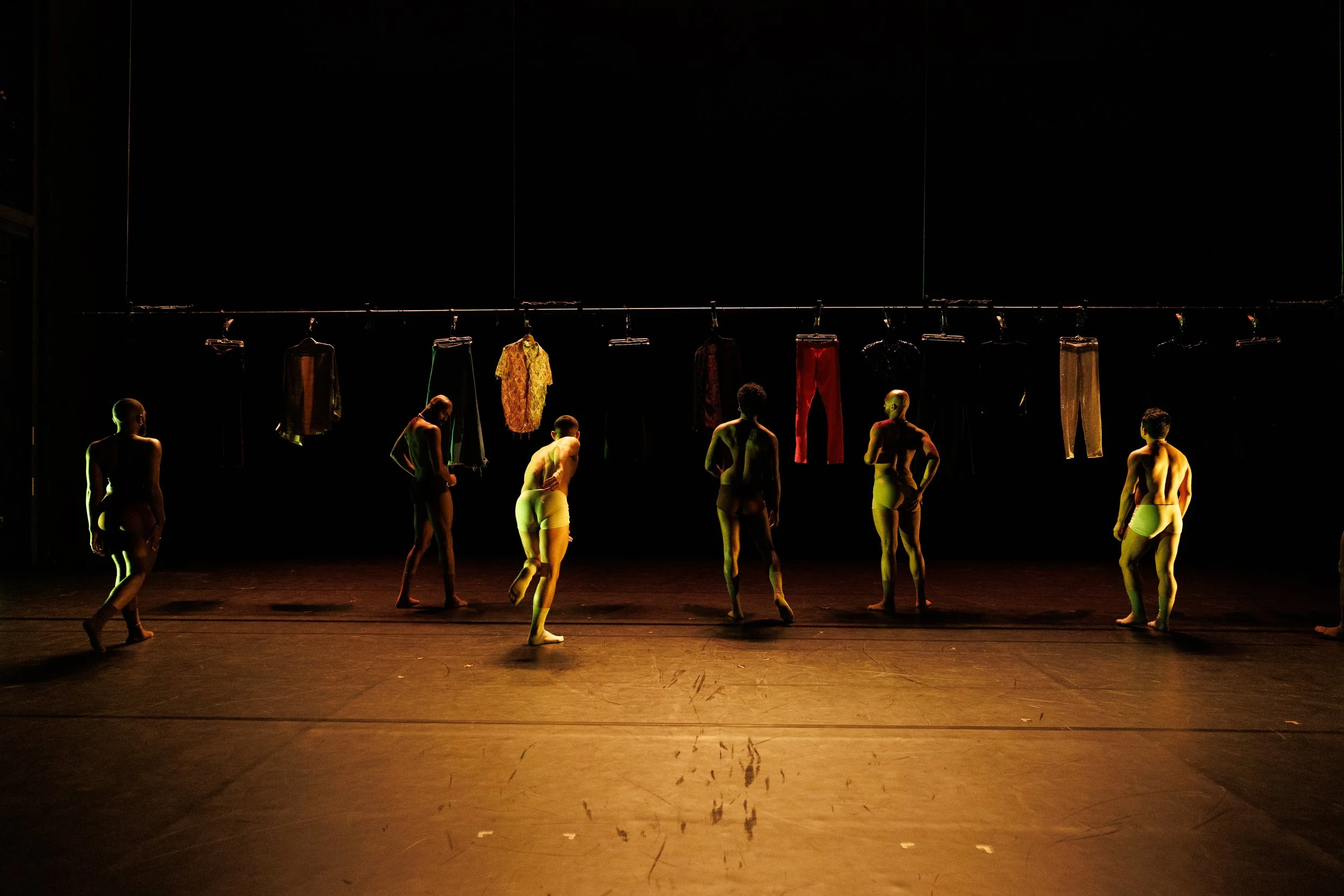 Seven dancers dancing beneath a clothesline in Sissies: Something Perfect Between Ourselves by J'Sun Howard and Bernard Brown