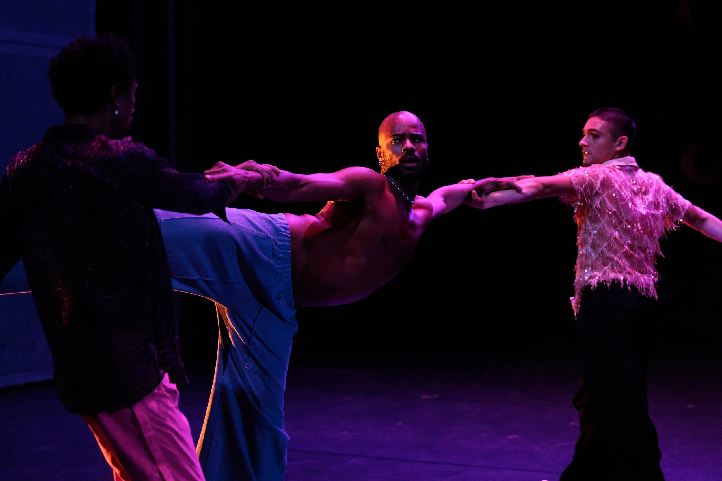 Three dancers holding hands during a trio in Sissies: Something Perfect Between Ourselves.