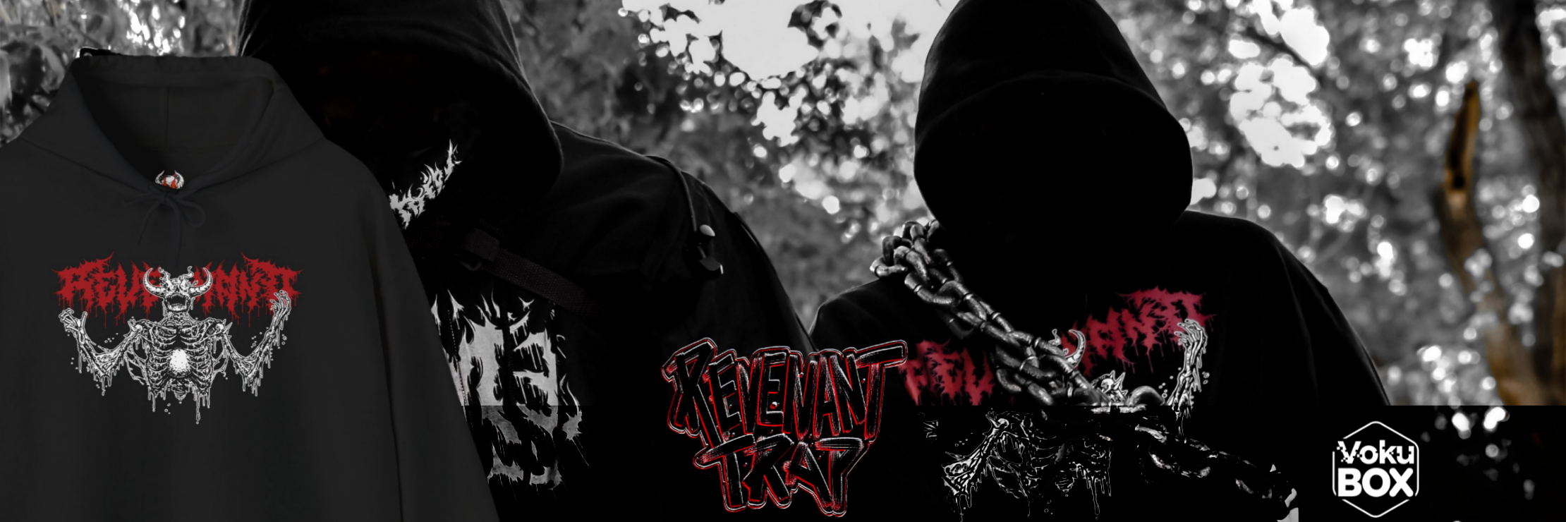 Three people dressed in black clothing with graphic designs and chains, standing outdoors in front of a blurred background of trees and leaves.