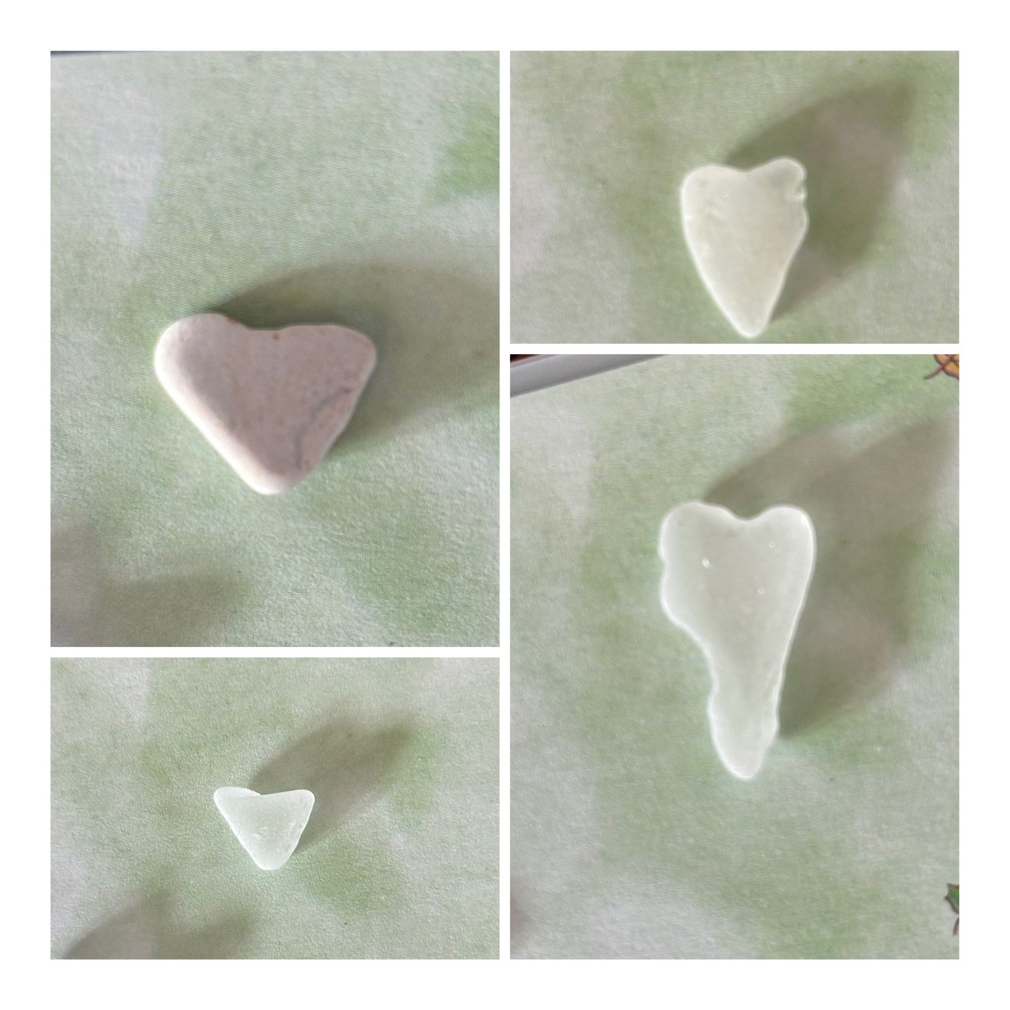 A collage of four close-up photos showing a small, heart-shaped object made of translucent material, possibly glass or plastic, placed on a light green surface.
