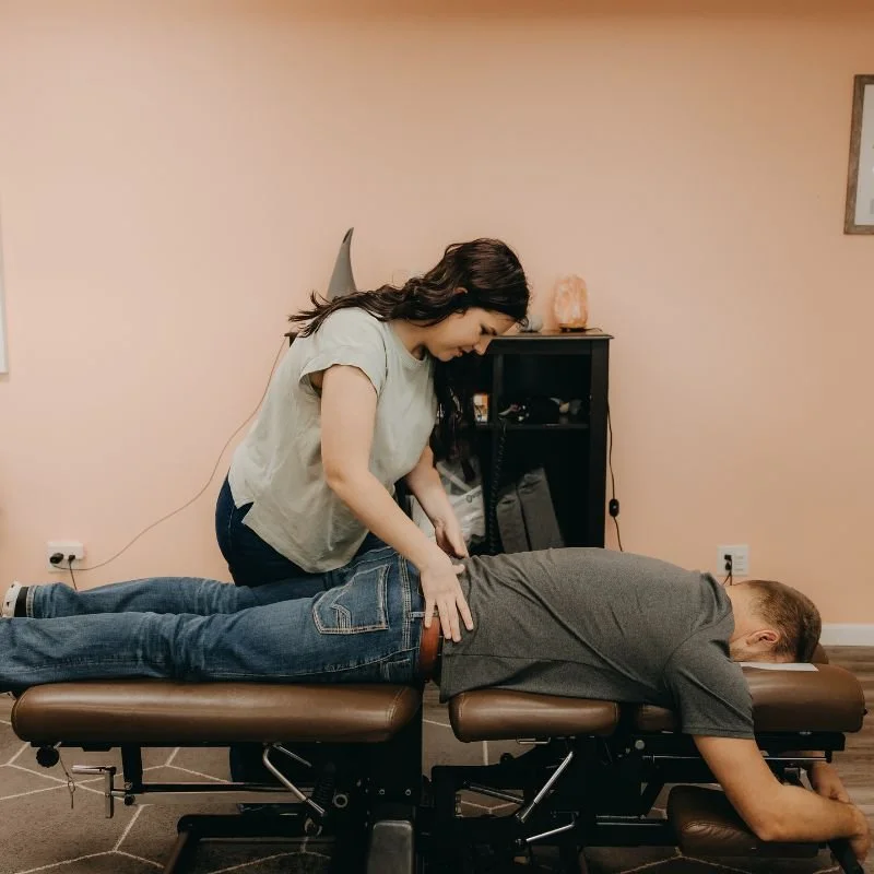 Dr. Brauer doing a chiropractic adjustment