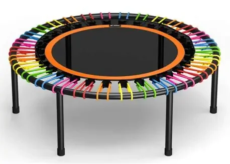 Colorful mini trampoline with a black jumping surface and a safety enclosure made of multicolored curved clips around the edge.