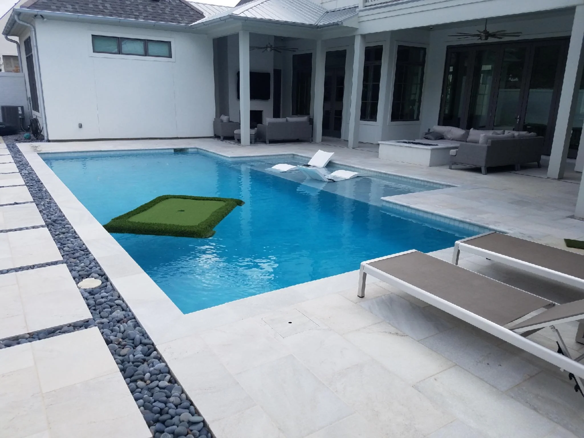 Custom-designed geometric residential pool in Baton Rouge built by Gulf South Pools & Outdoors.