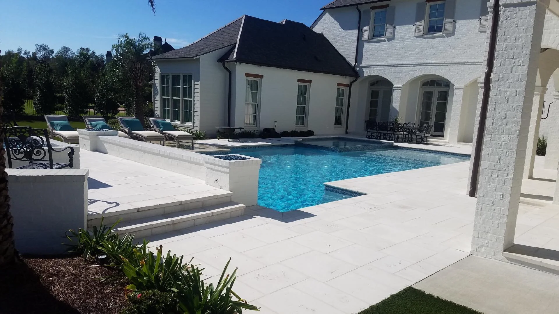Custom-designed geometric residential pool in Baton Rouge built by Gulf South Pools & Outdoors.