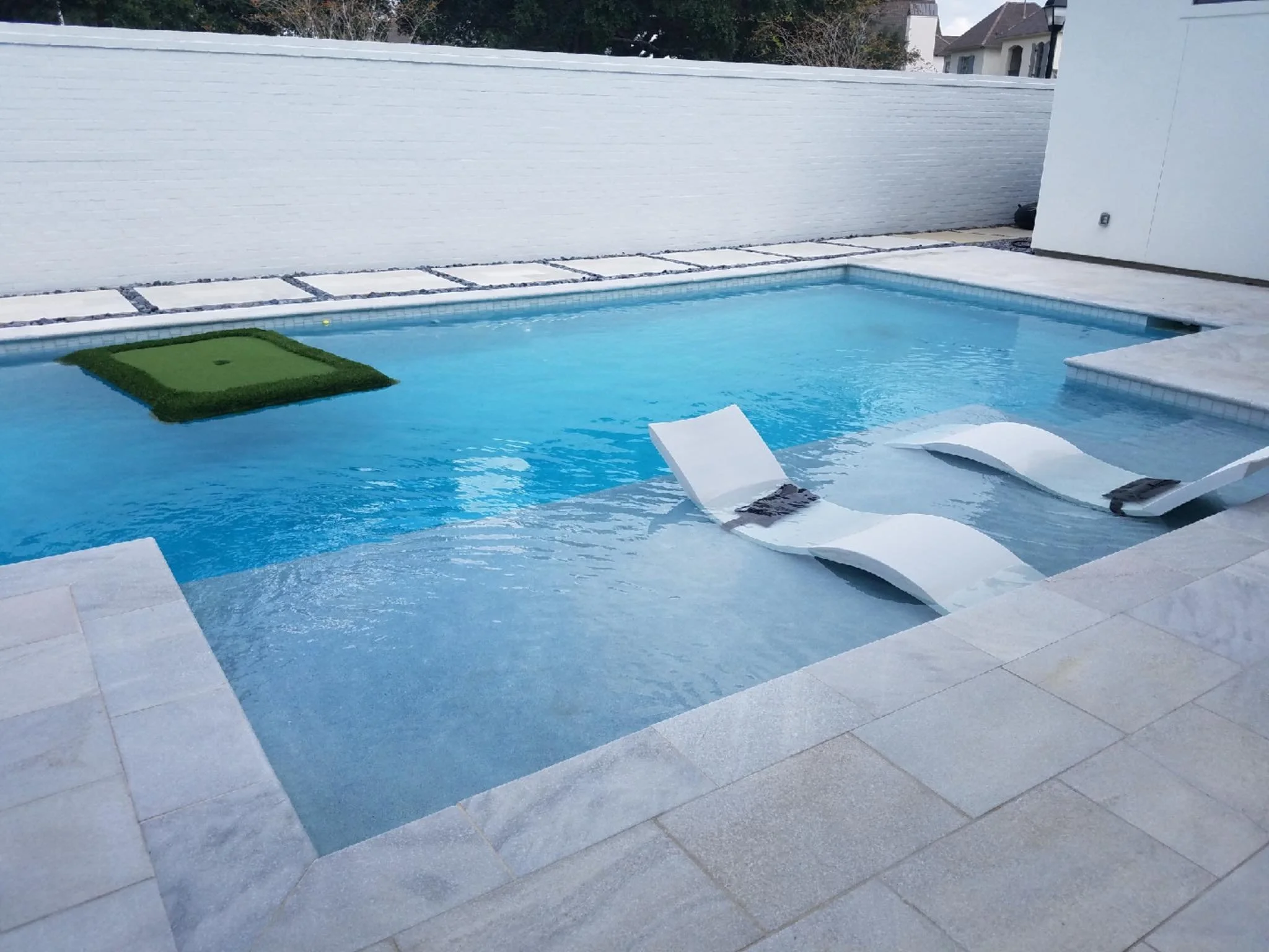 Custom-designed geometric residential pool in Baton Rouge built by Gulf South Pools & Outdoors.