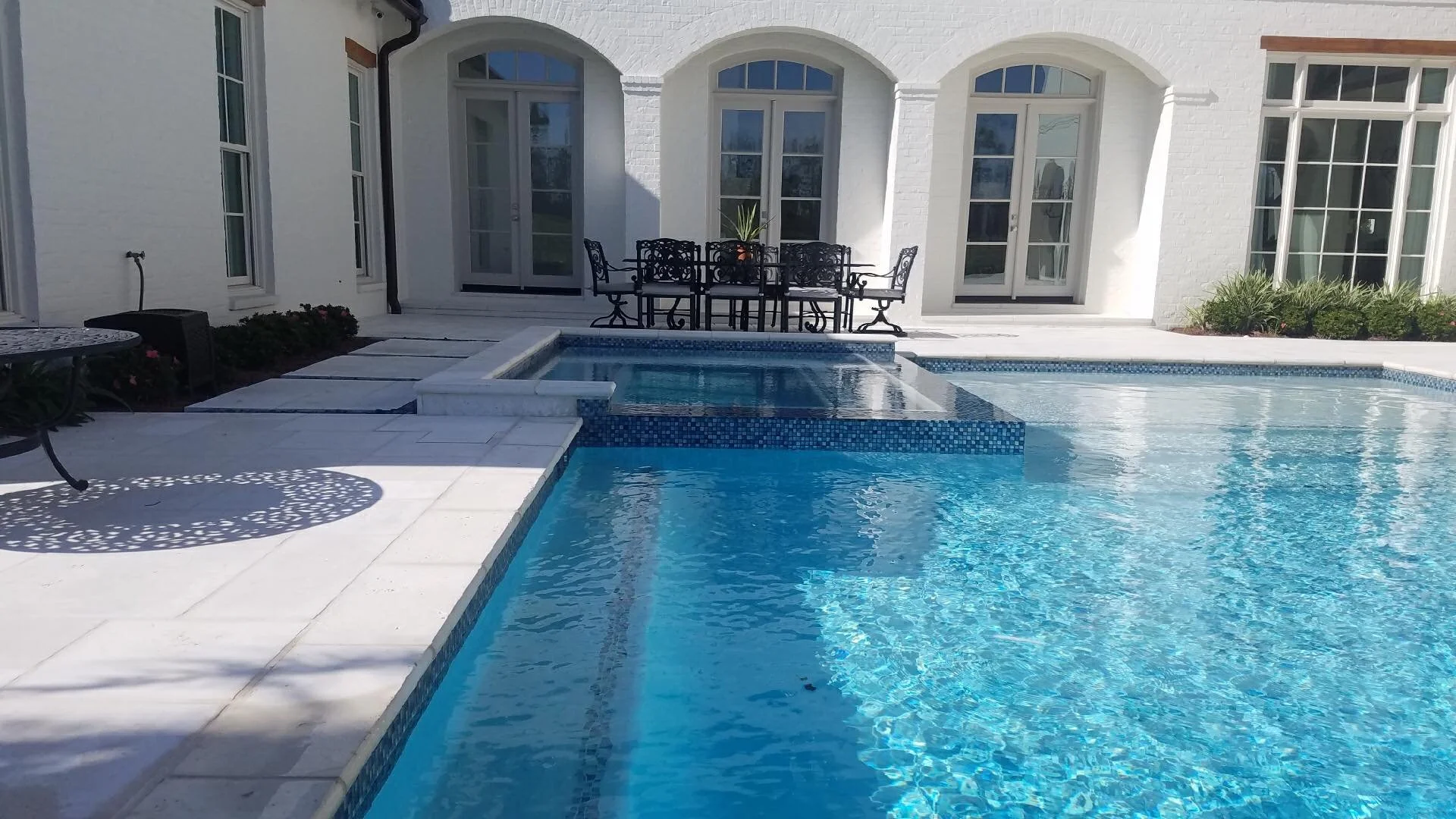 Custom-designed geometric residential pool in Baton Rouge built by Gulf South Pools & Outdoors.