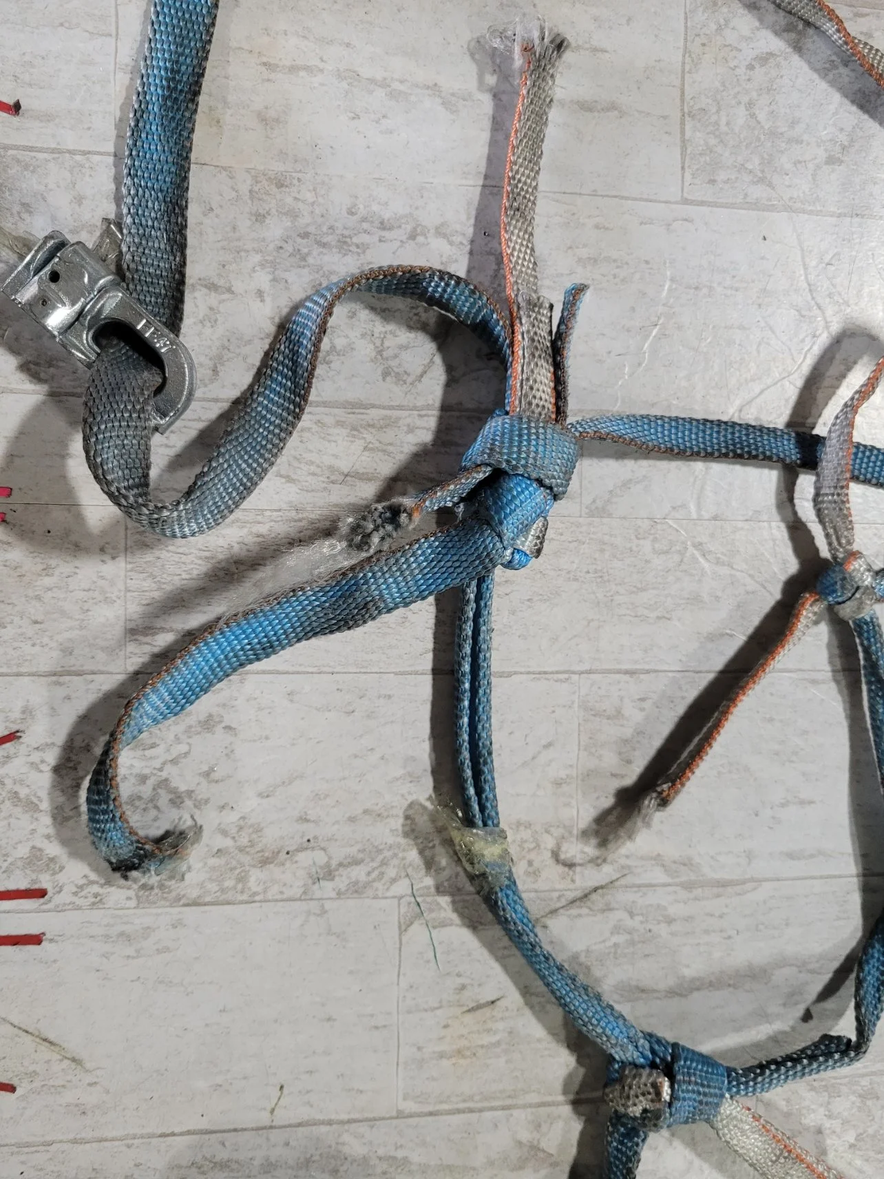 Damaged cargo restraint assembly prior to repair