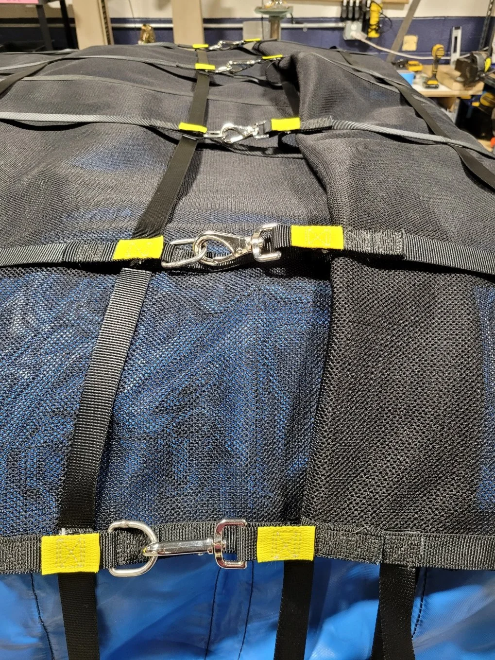 Close-up of adjustment hardware on fully loaded roof rack restraint assembly