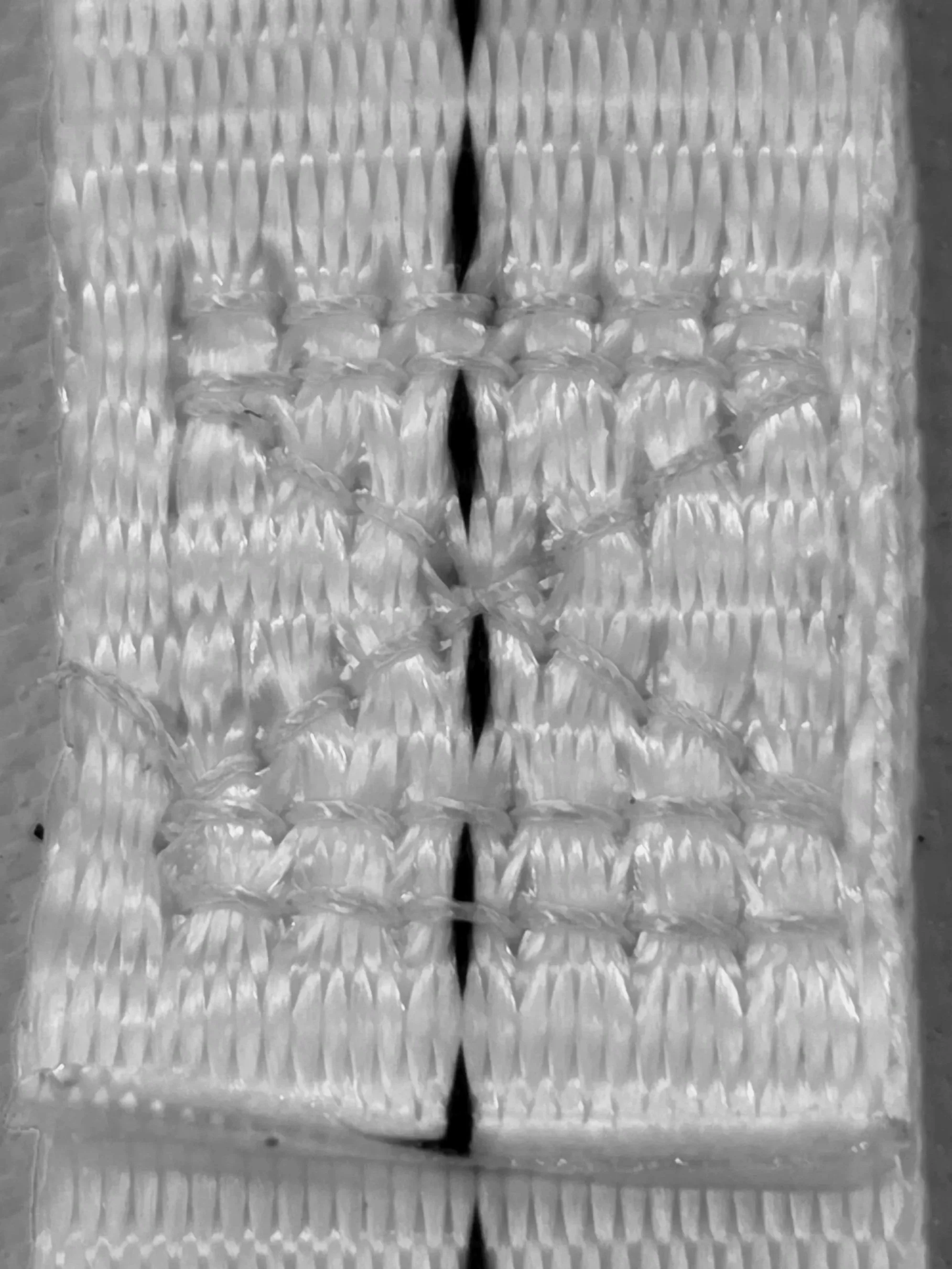 Close-up of restraint webbing showing stitch pattern