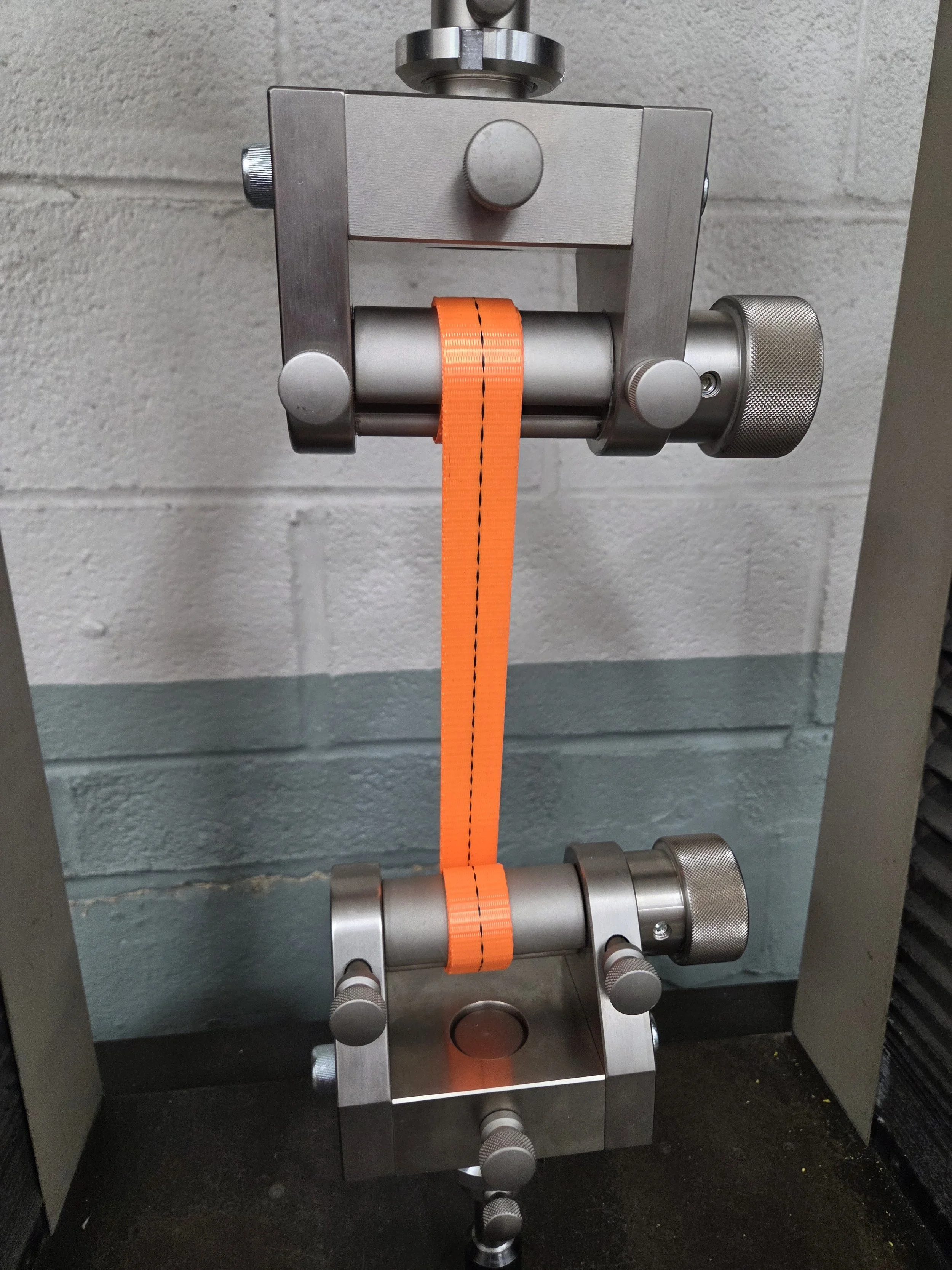 Webbing sample undergoing tensile strength testing