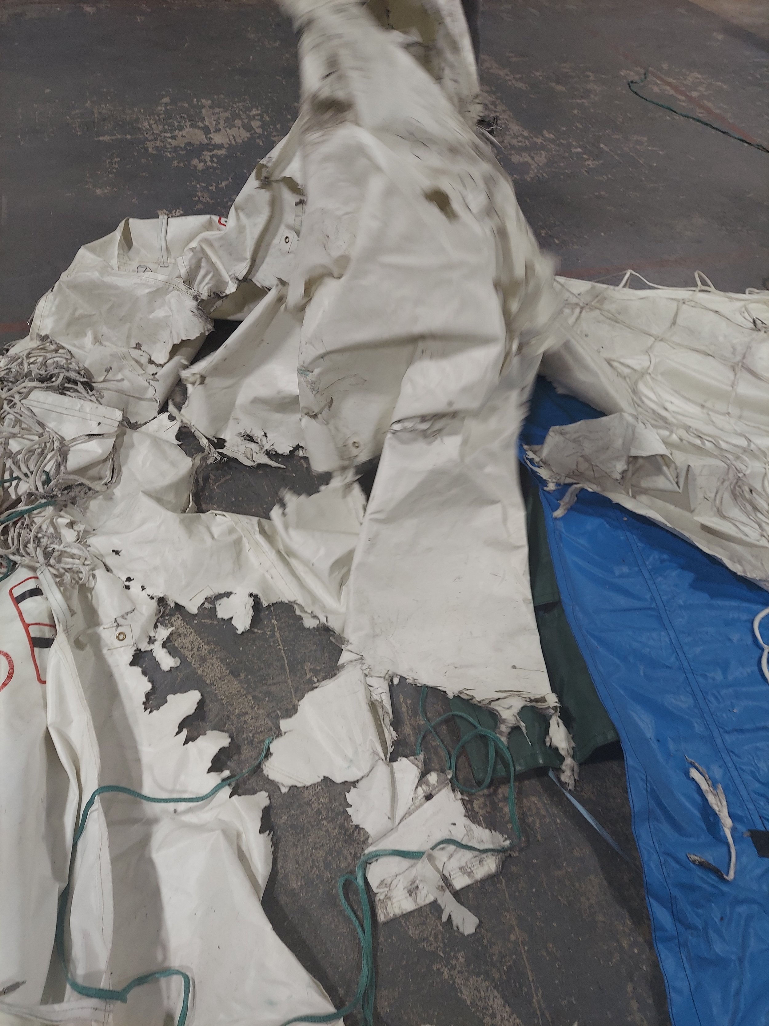 Damaged fire containment cover (FCC) prior to repair