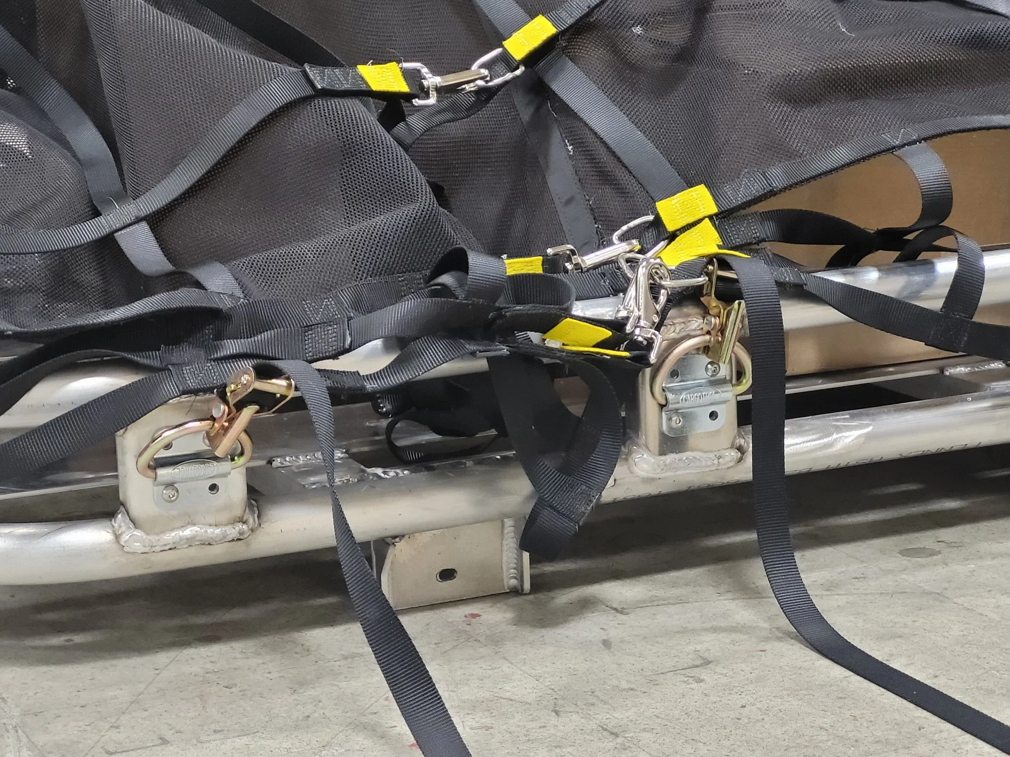 Close-up of adjustment hardware on custom roof rack restraint assembly