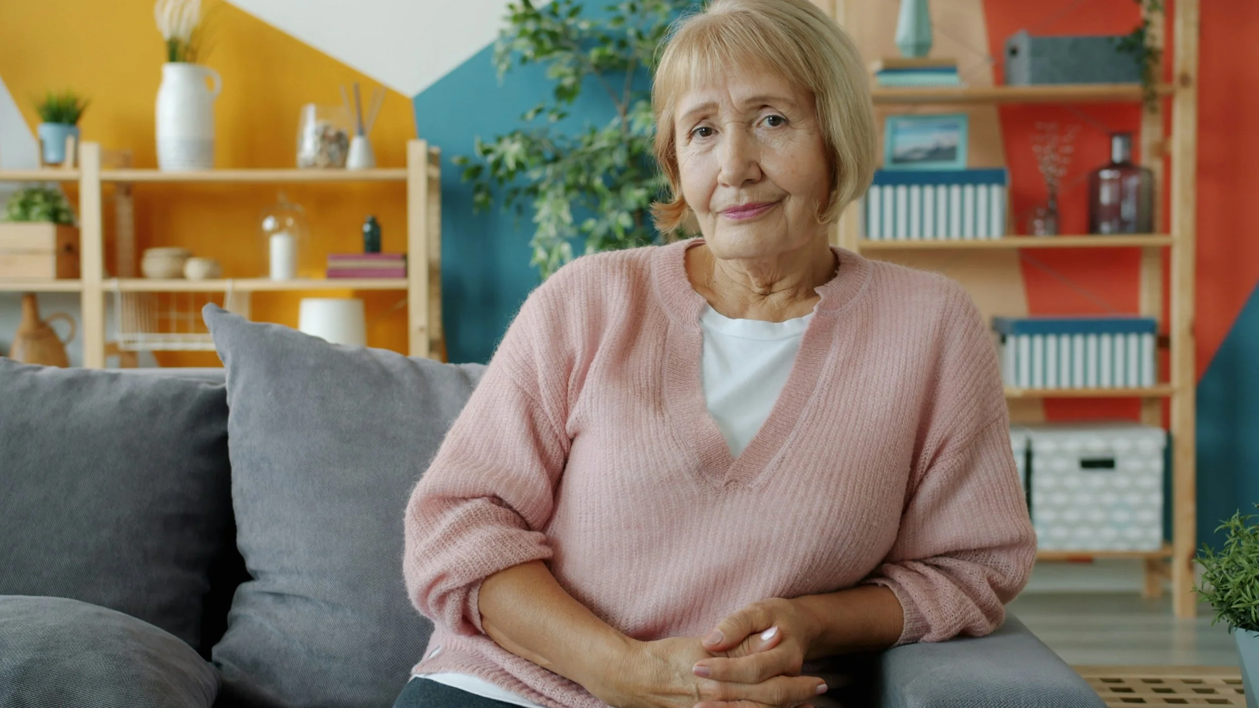 Concerned 73-year-old woman experiencing symptoms of aortic stenosis, seeking a specialist consultation for TAVI heart valve replacement