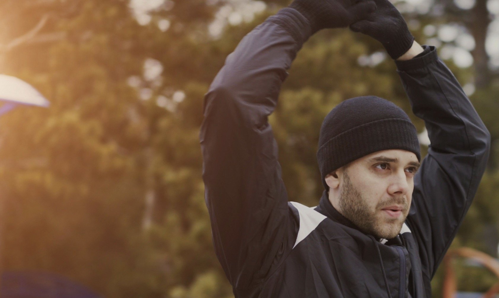 Active 30-year-old man jogging to maintain cardiovascular health, seeking a preventative cardiac risk assessment and heart screening for long-term wellness