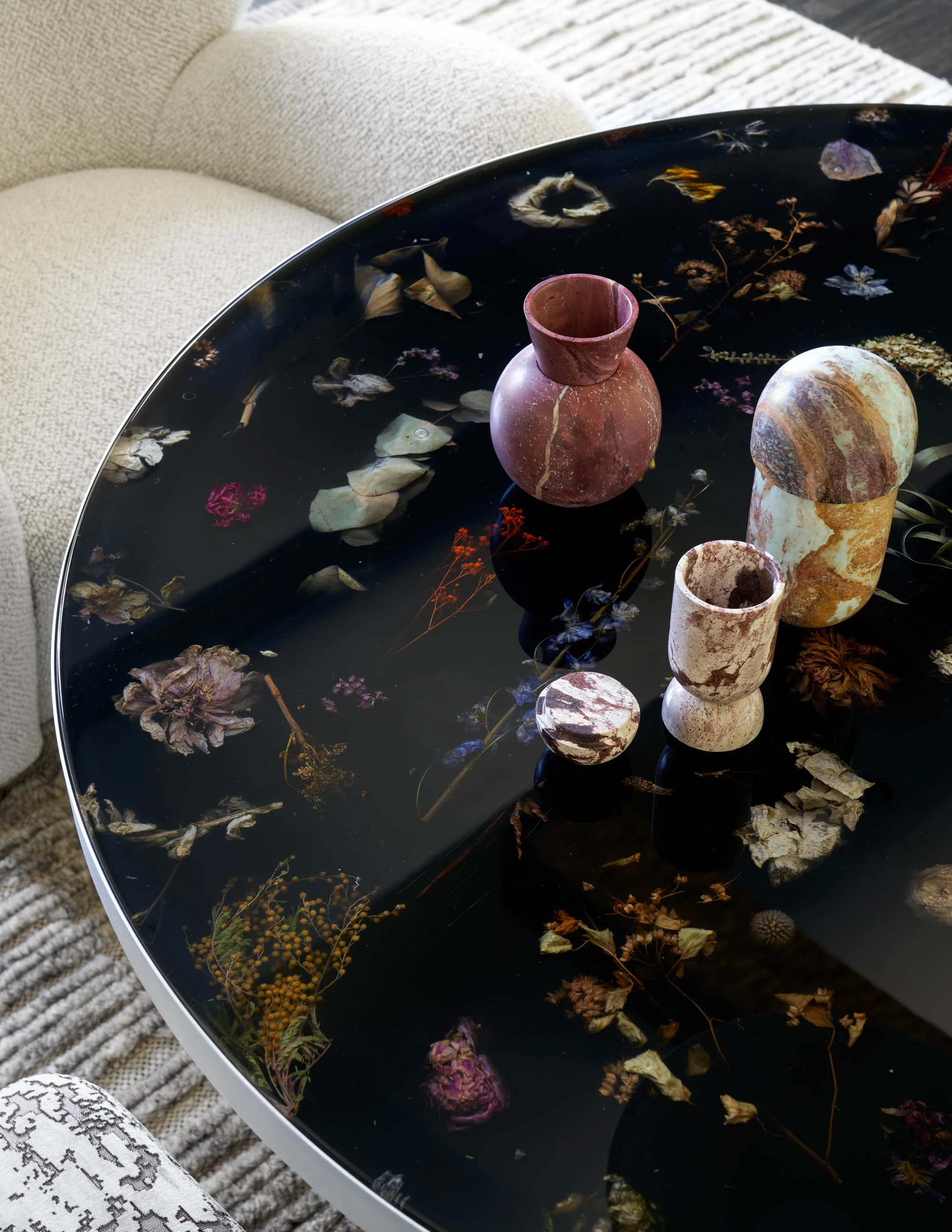 Custom resin chat table with preserved botanicals and collectible marble objects in luxury interior Marcin Rusak