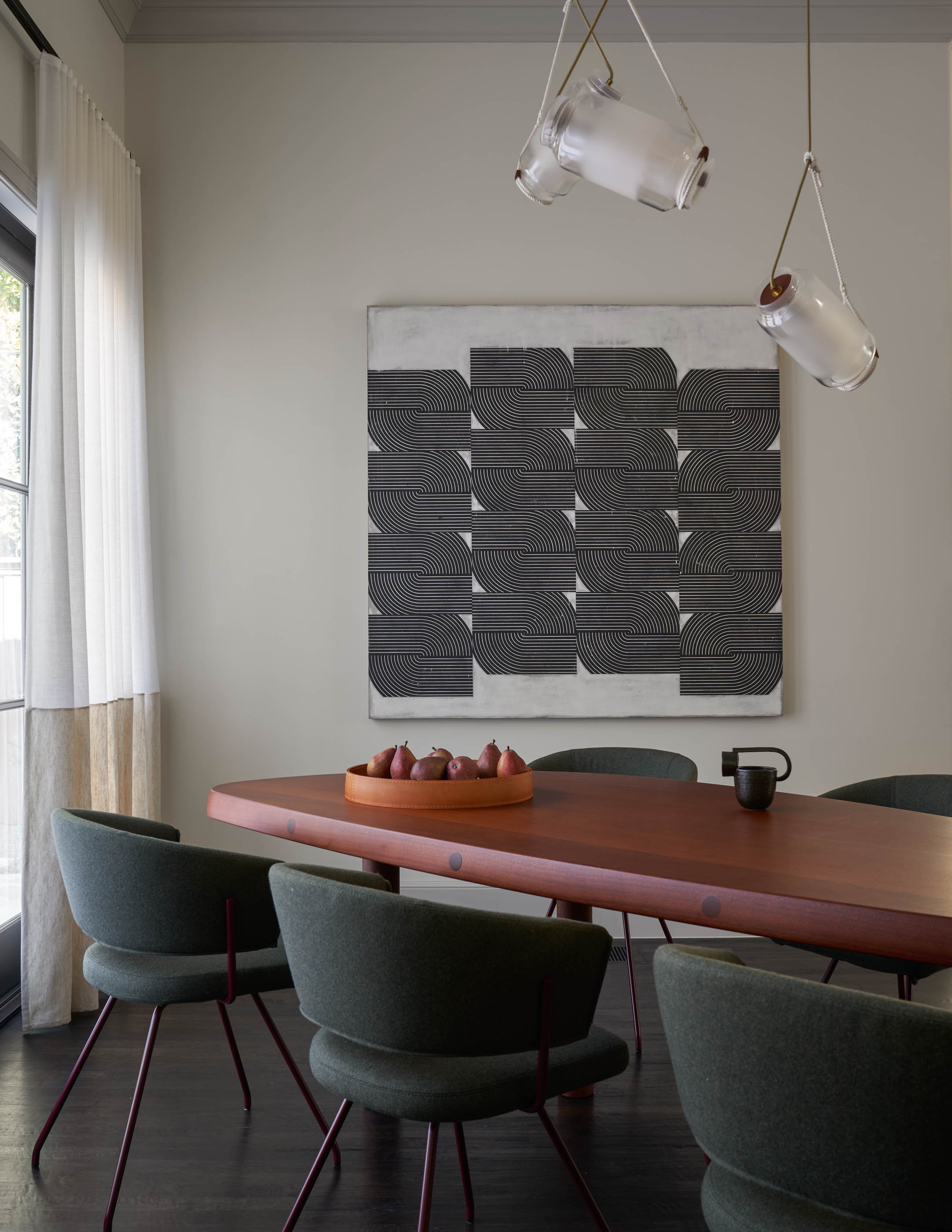 Modern luxury dining room with custom walnut dining table, sculptural pendant lighting, and contemporary artwork doommood Charlotte Perriand table, Brendan Ravnhill Pendant