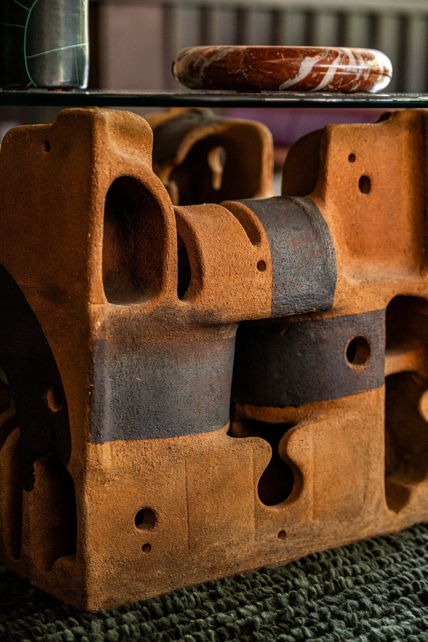 Hand-built ceramic sculptural table base with raw texture and earthy tones Vintage Ceramic Base Cocktail Table by George Greenamyer for Vladimir Kagan in a modern residential interior.