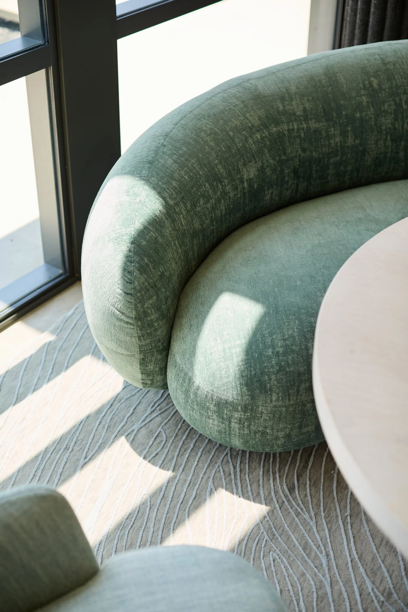 tacchini sofa, rische collection seren table arik levy sculpture, bensen chairs, atelier agahzadeh rug