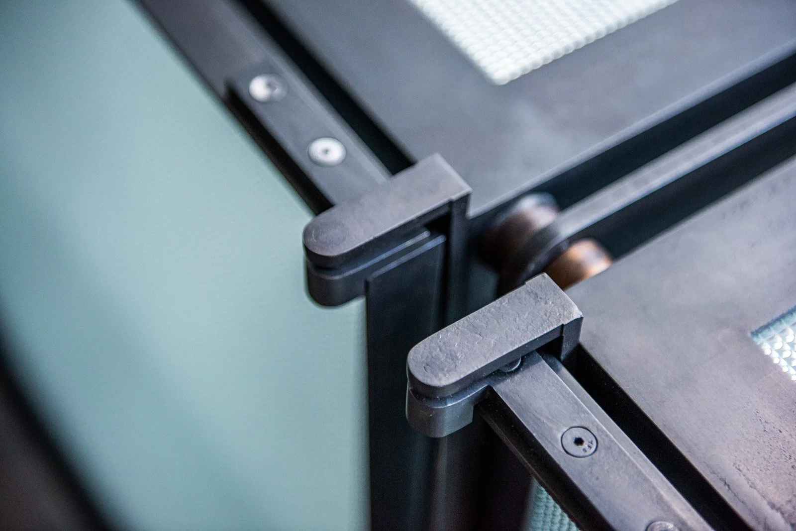 Precision machined metal hinge and hardware detail on custom architectural element designed by joshua rice and made by new format studio