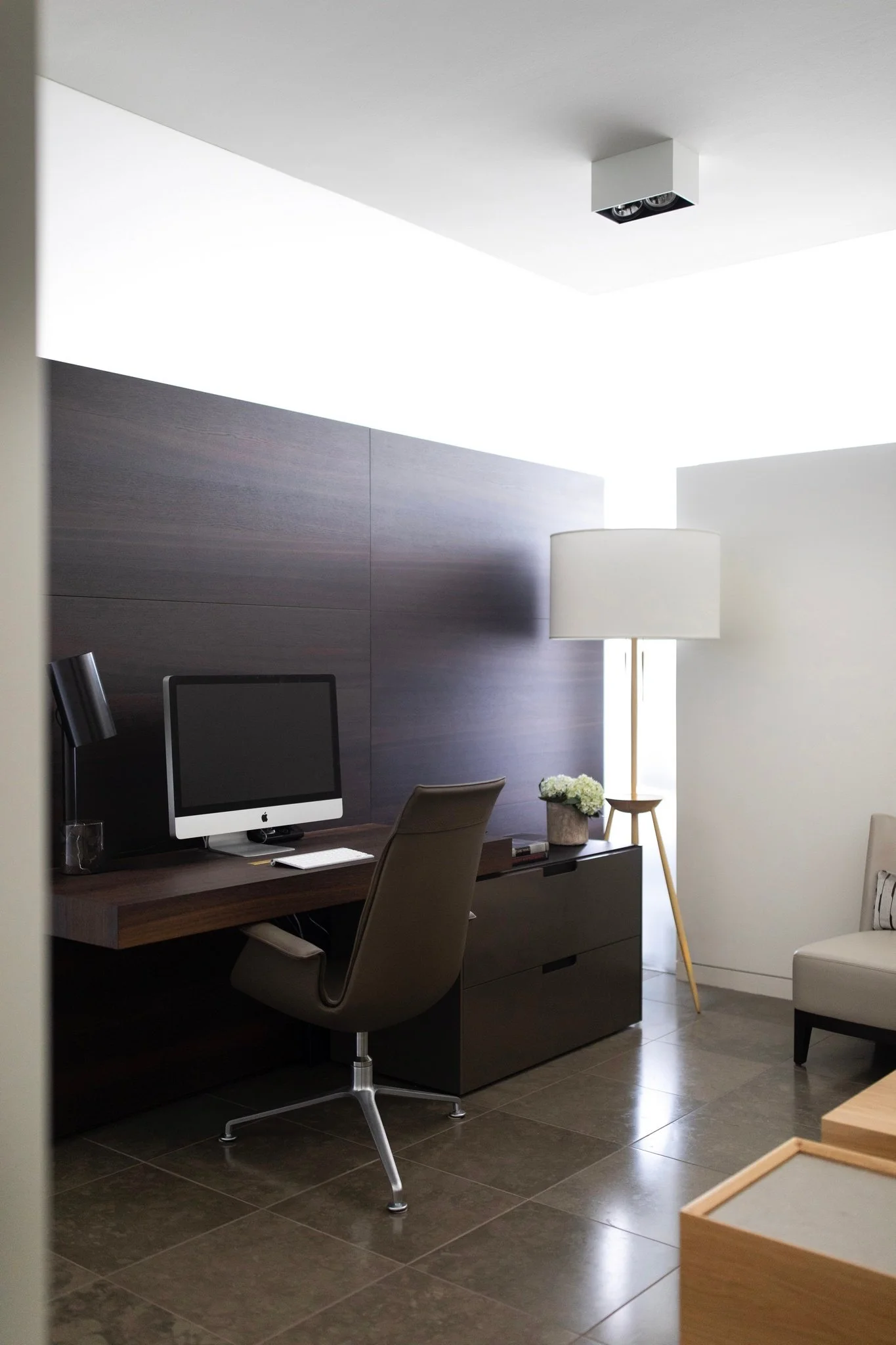 Modern luxury home office with custom walnut desk, leather task chair, and minimalist architectural lighting fabricius kastholm, bddw, fort standard, holly hunt, apple computer
