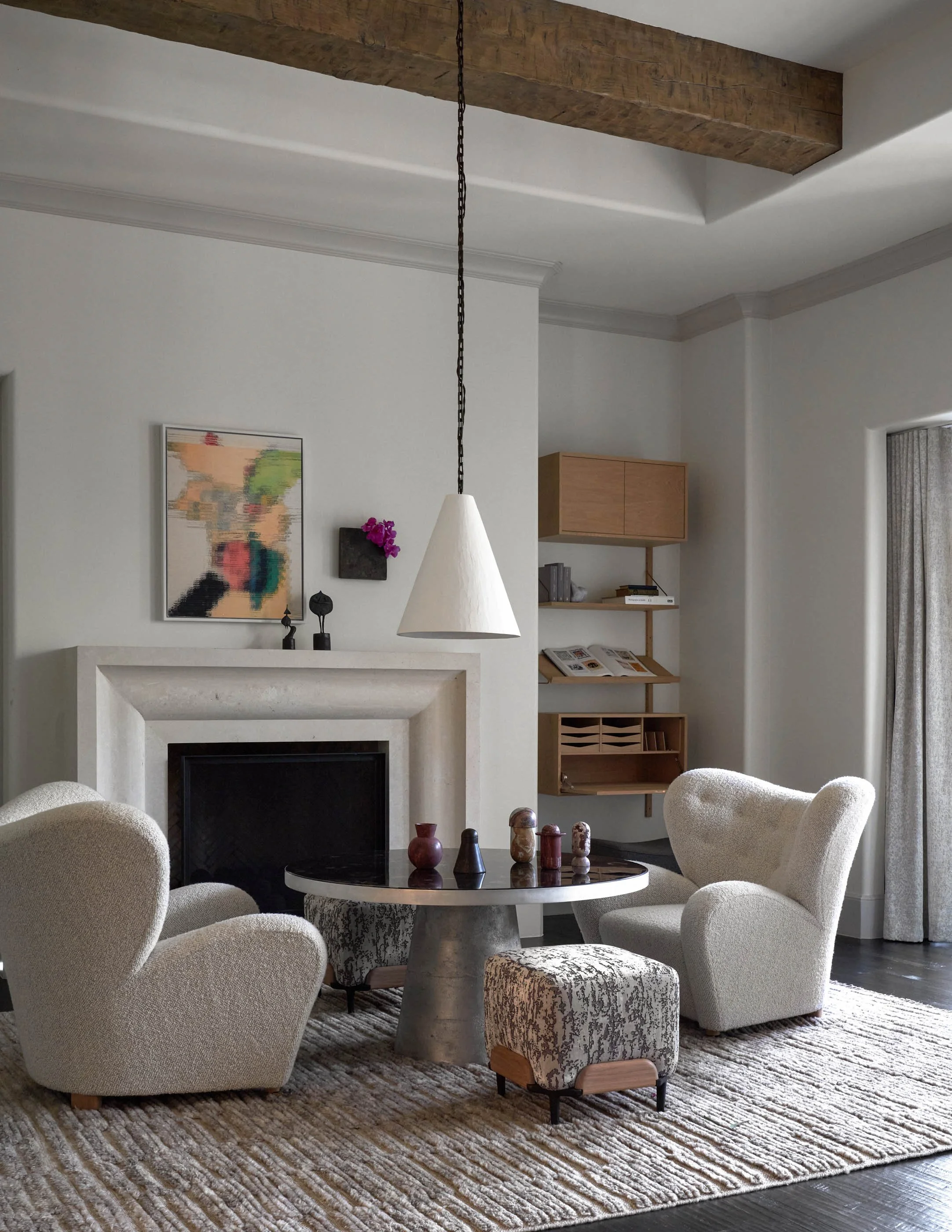 Soft and Serene modern sitting room with stone fireplace, sculptural lounge chairs, and warm neutral textures The Tired Man Lounge Chair By Flemming Lassen marcin Rusak