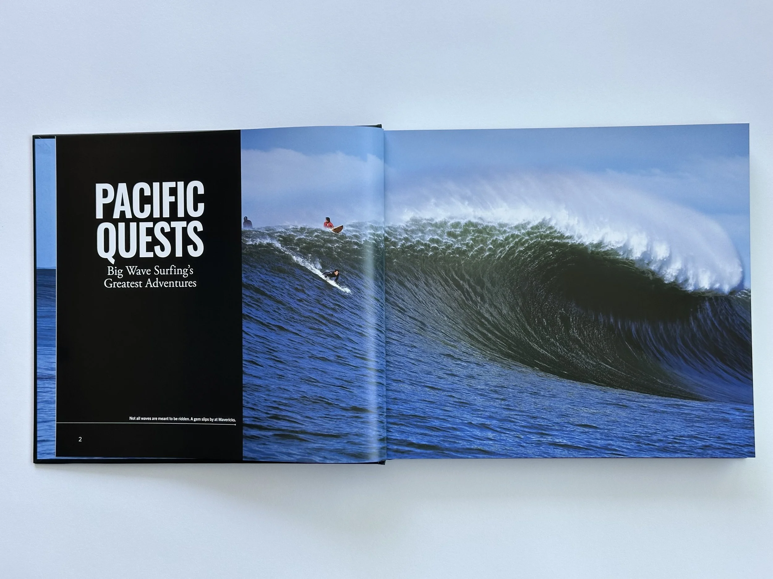 Pages within Pacific Quests book. Features surfers on a large wave.