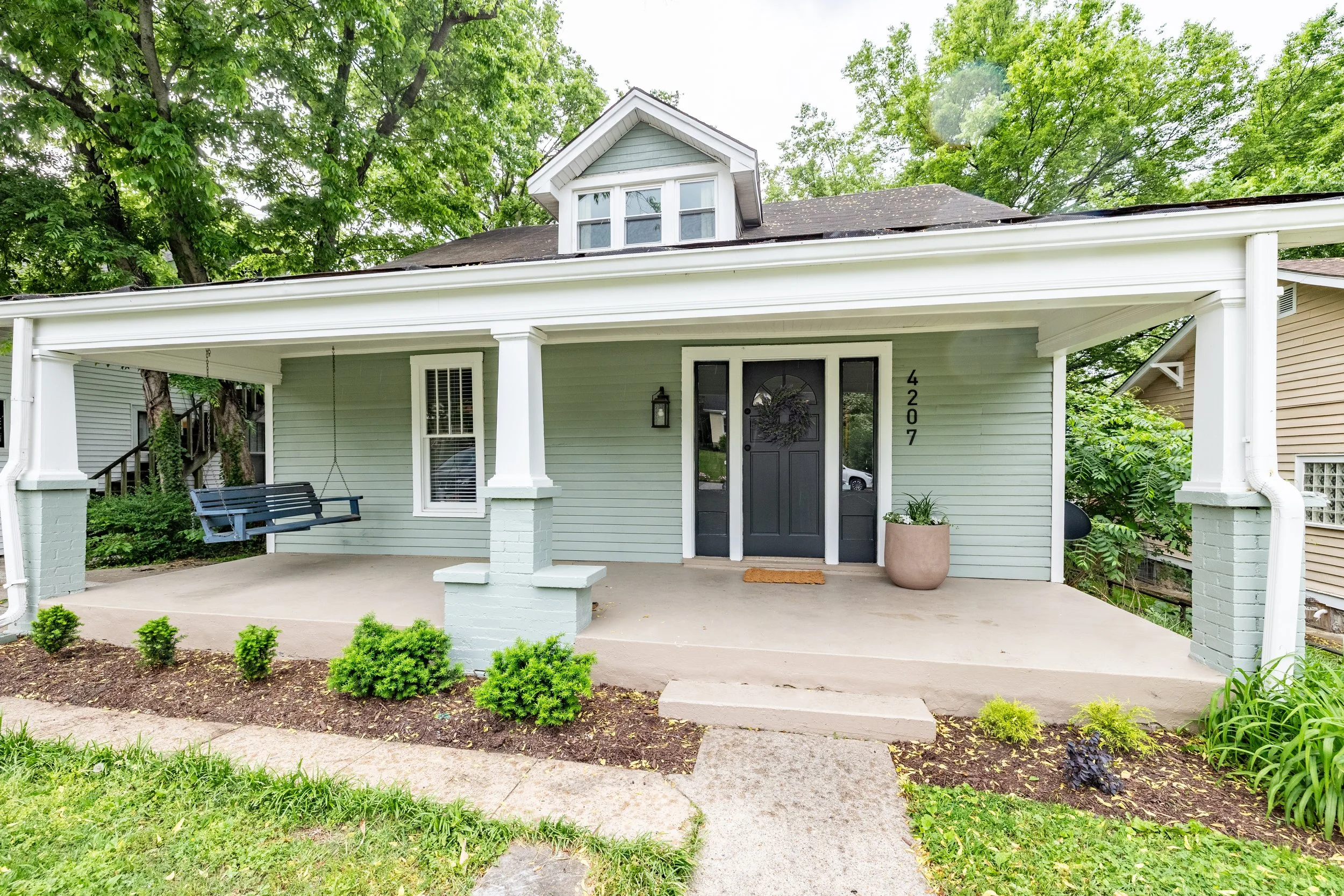Completed home exterior after project planning and decision support, showing finished renovation and improved curb appeal