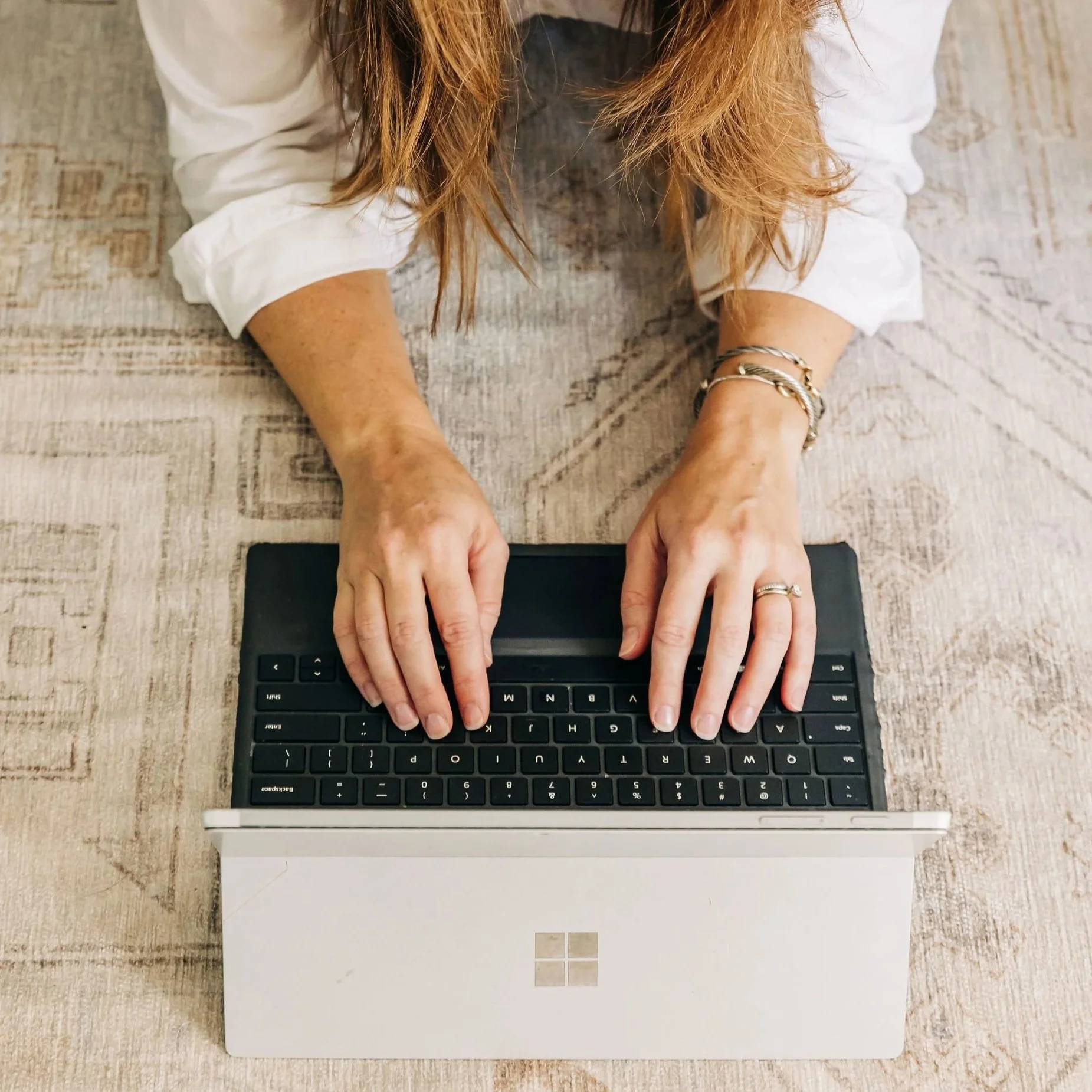 Laptop Open and Typing to Demonstrate Planning Before  Hiring Nanny, House Manager or Home Help