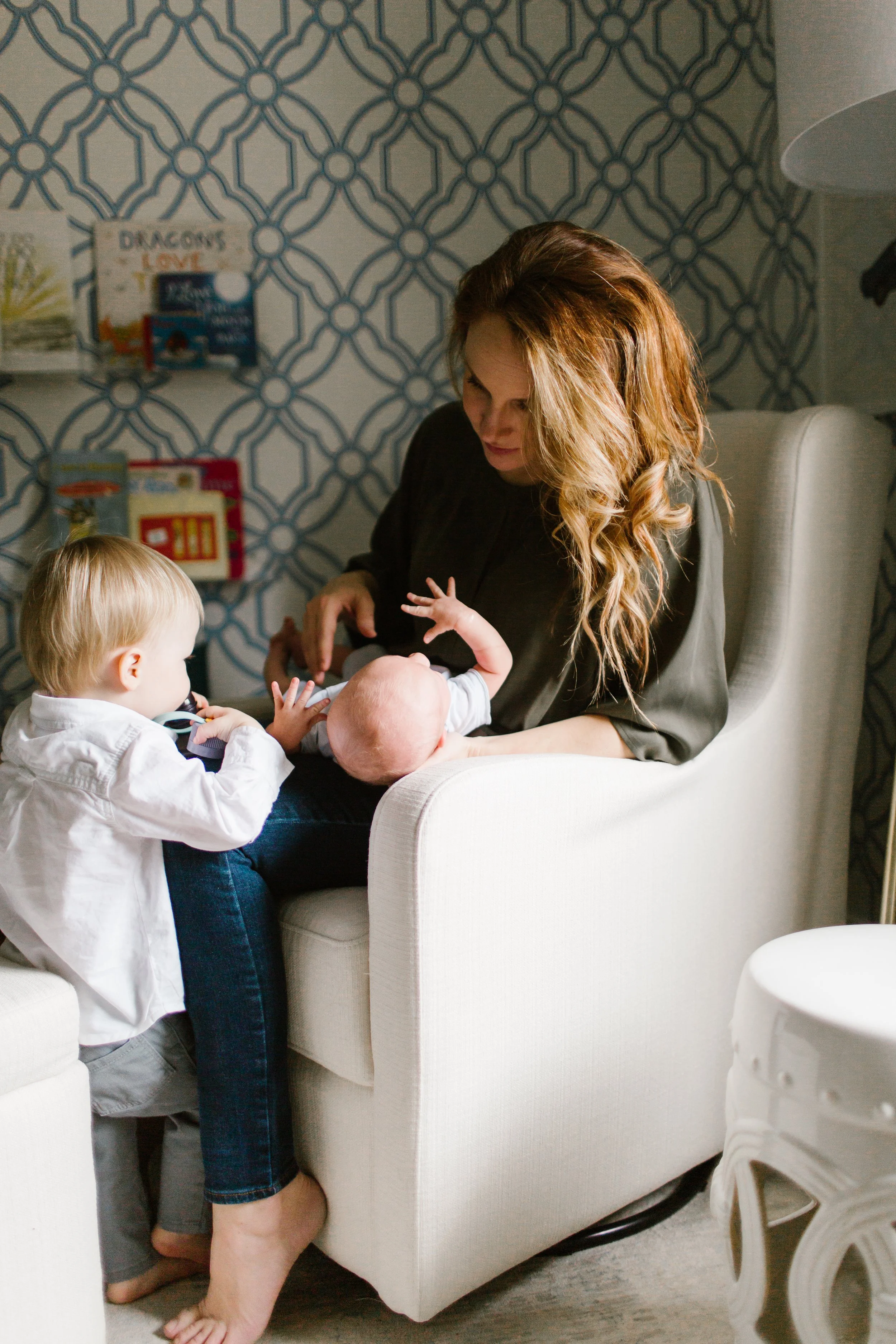Mom with young toddler and new baby to illustrate preparing for a new season