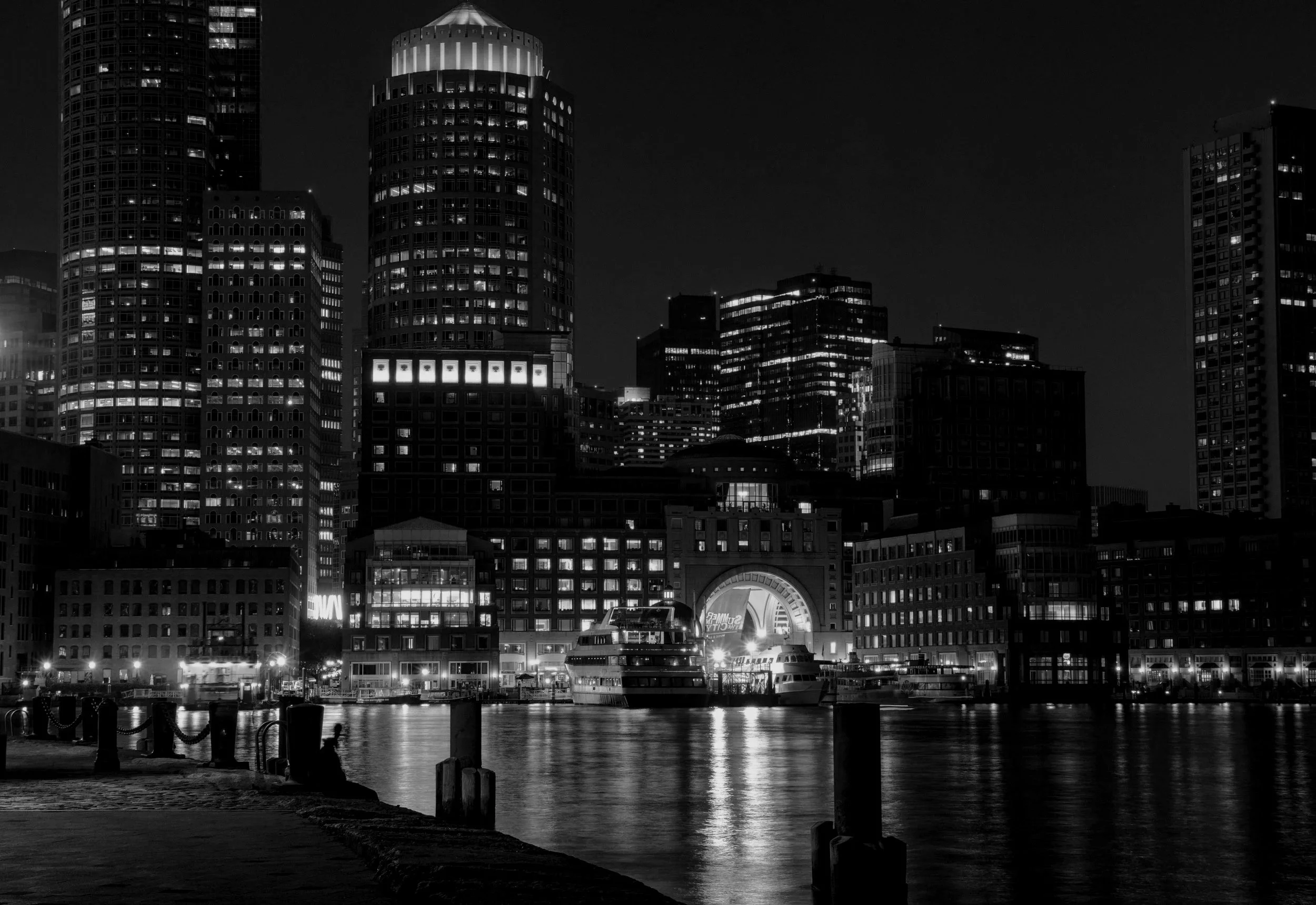 black and white Boston harbor at night