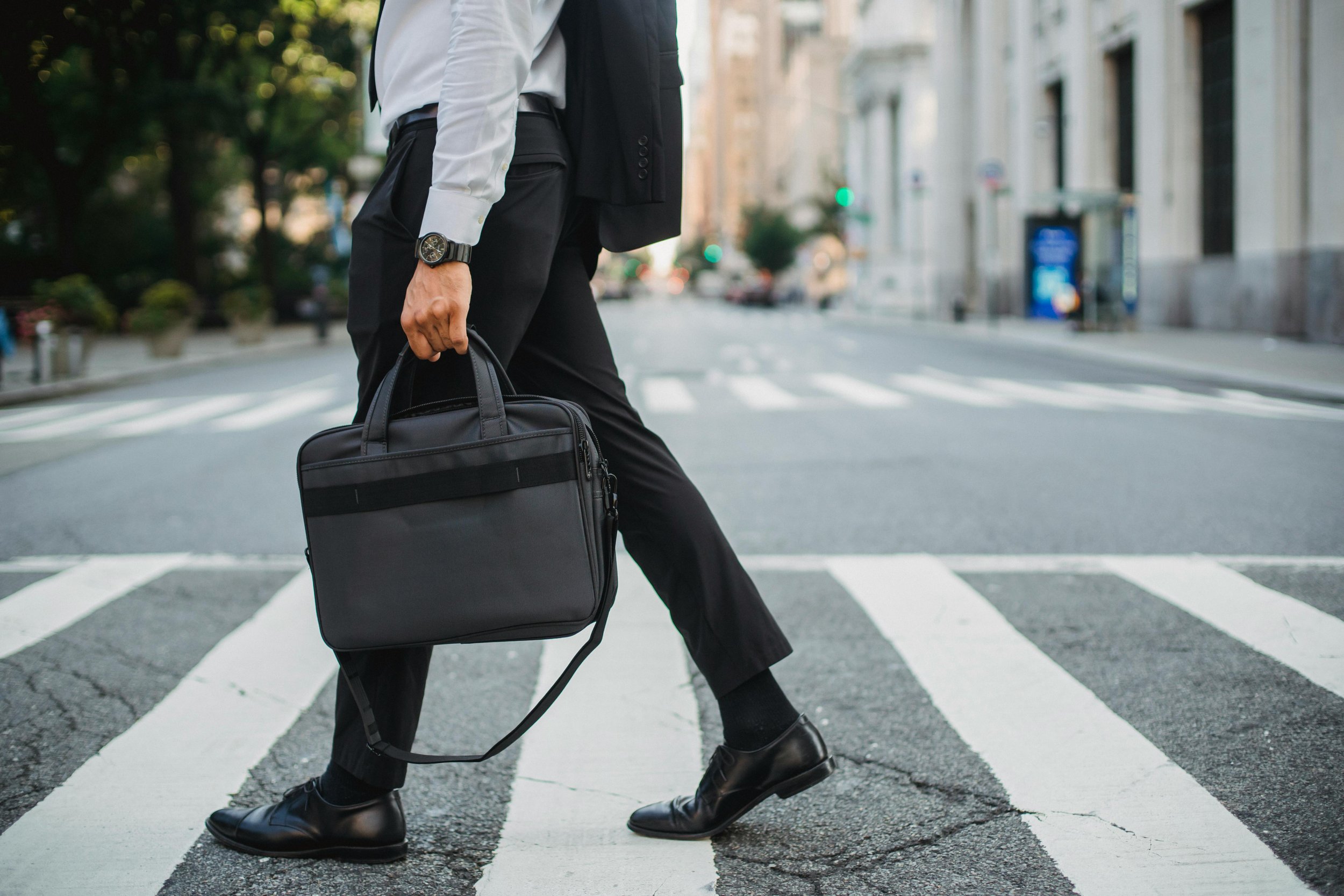 A professional walking in a DC office setting — representing the high-achieving adult privately managing an eating disorder at Elizabeth Gordon Psychology