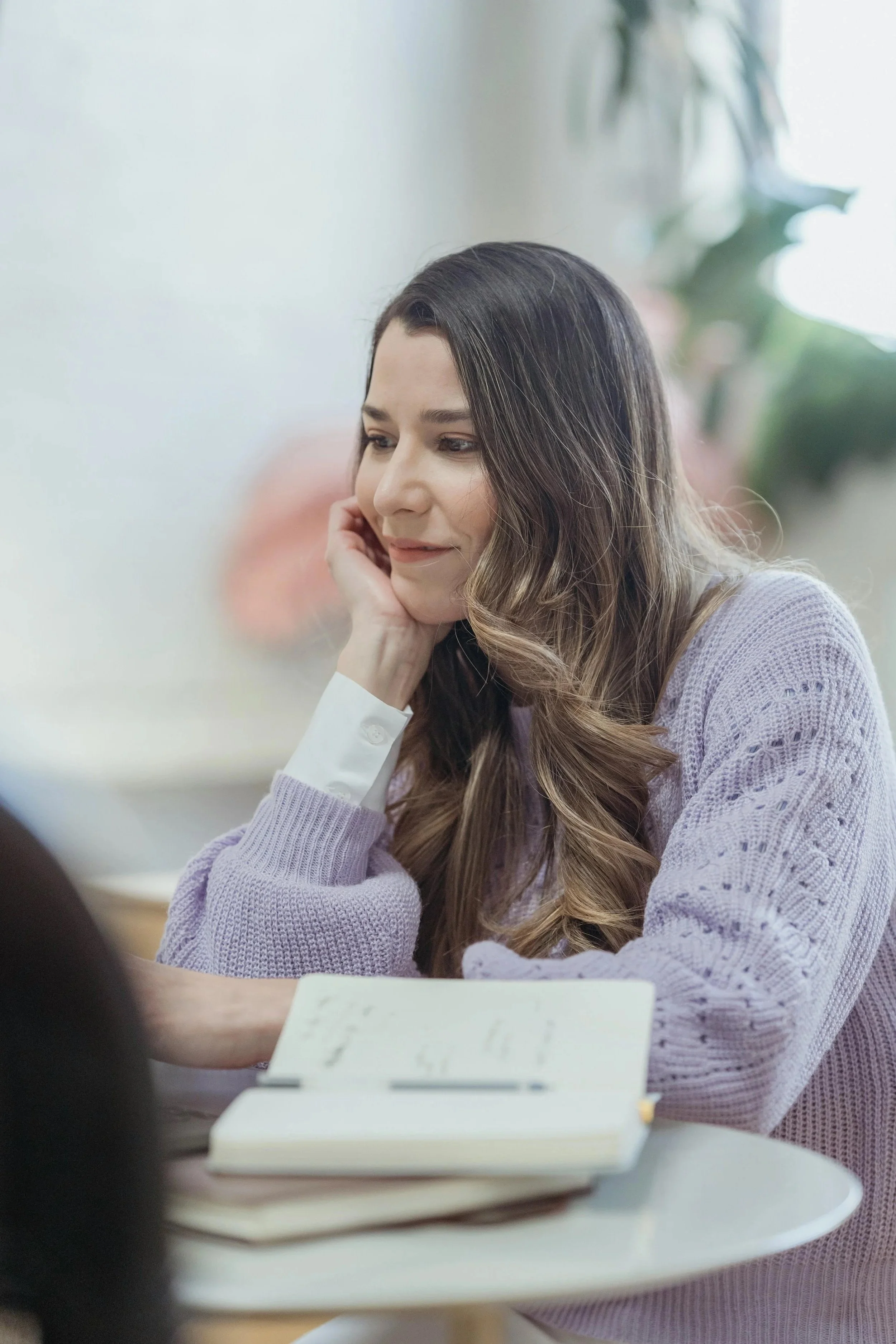 A person pausing thoughtfully at work — representing the high-achieving adult navigating anxiety and perfectionism at Elizabeth Gordon Psychology in Silver Spring, MD